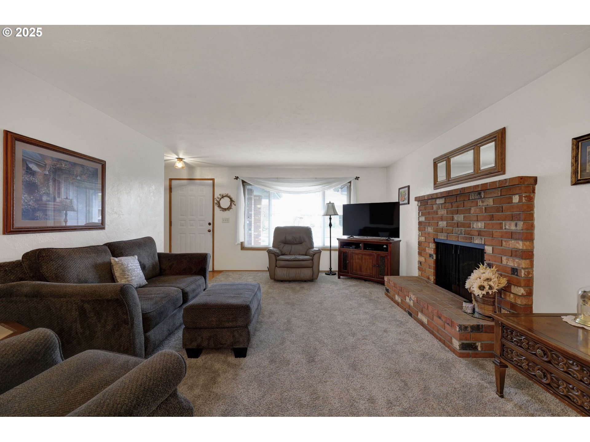 3670 Plumtree Drive Eugene, OR 97402 - Photo 12 of 47 a living room with furniture and a fireplace