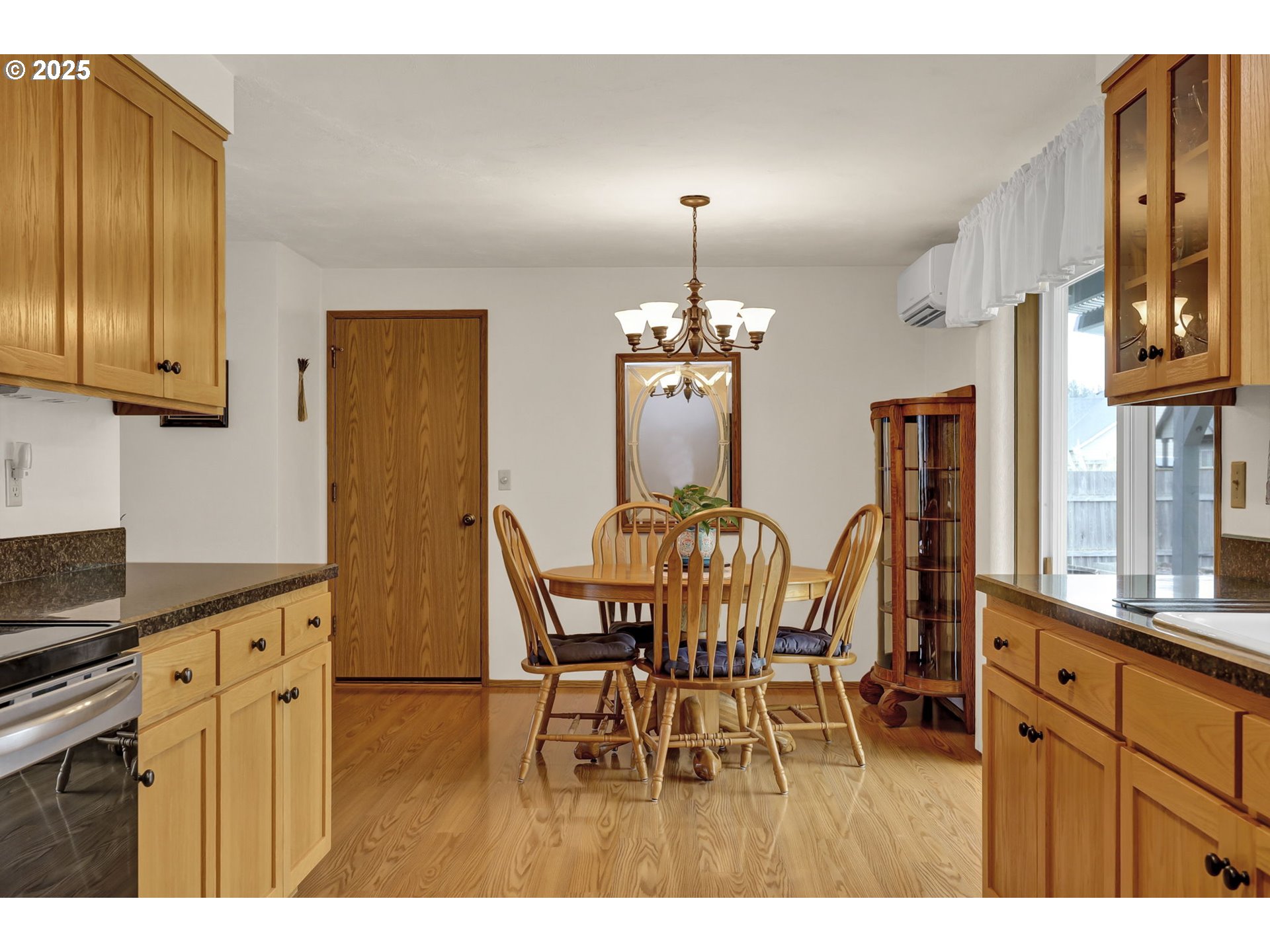 3670 Plumtree Drive Eugene, OR 97402 - Photo 19 of 47 a view of a dining room with furniture and chandelier