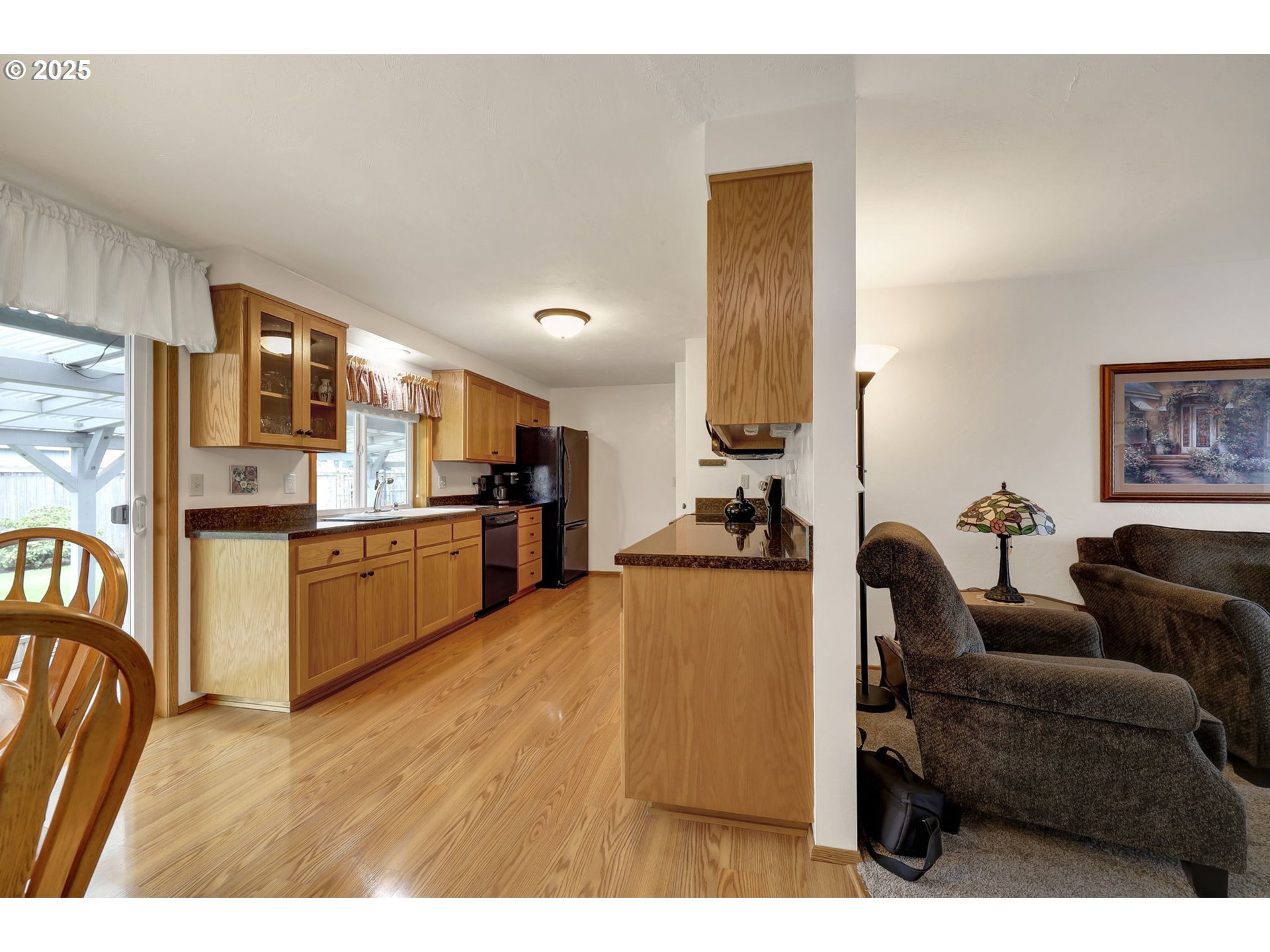 3670 Plumtree Drive Eugene, OR 97402 - Photo 23 of 47 a living room with furniture and kitchen view