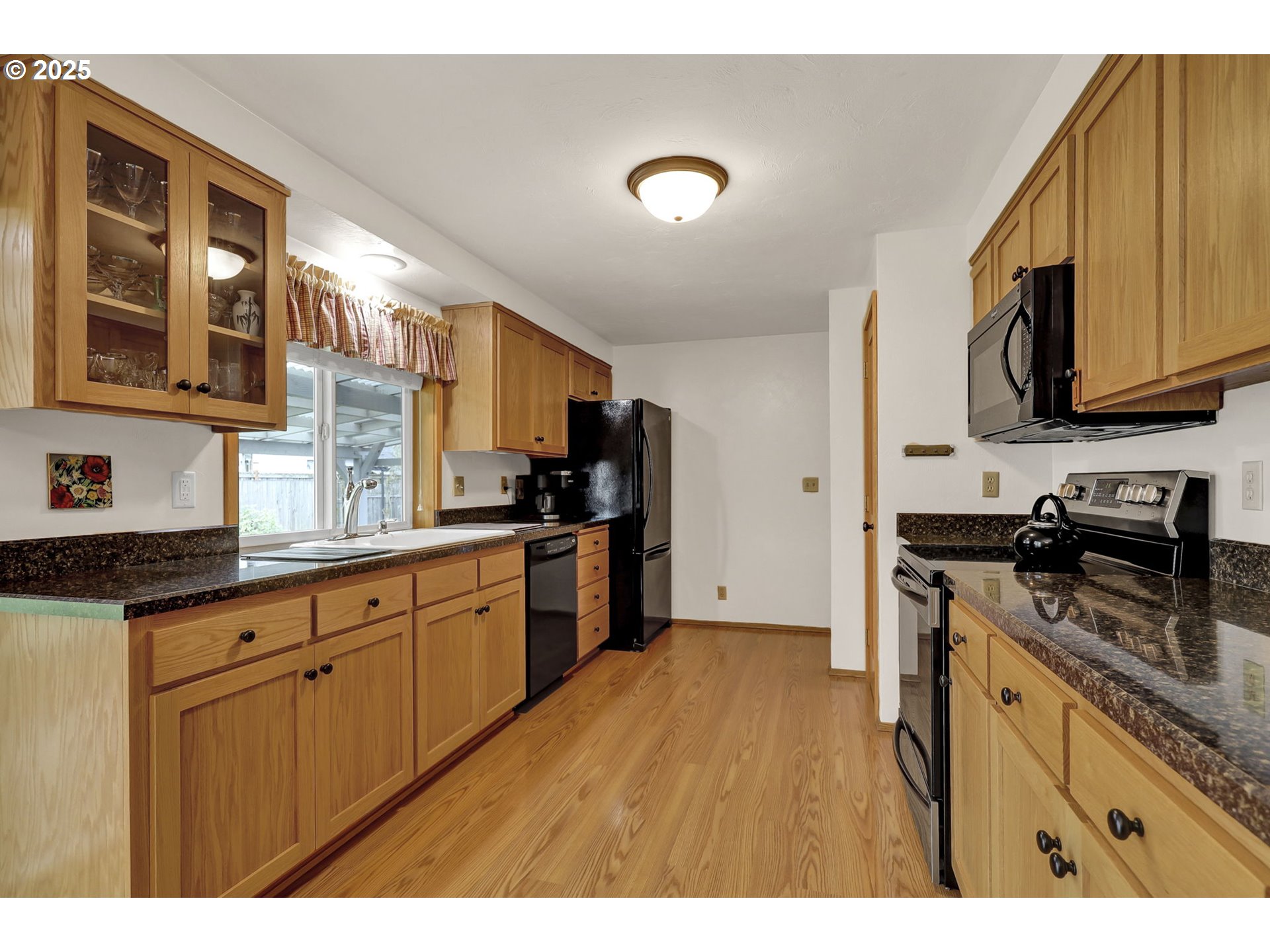 3670 Plumtree Drive Eugene, OR 97402 - Photo 24 of 47 a kitchen with stainless steel appliances granite countertop a stove a sink dishwasher and a refrigerator