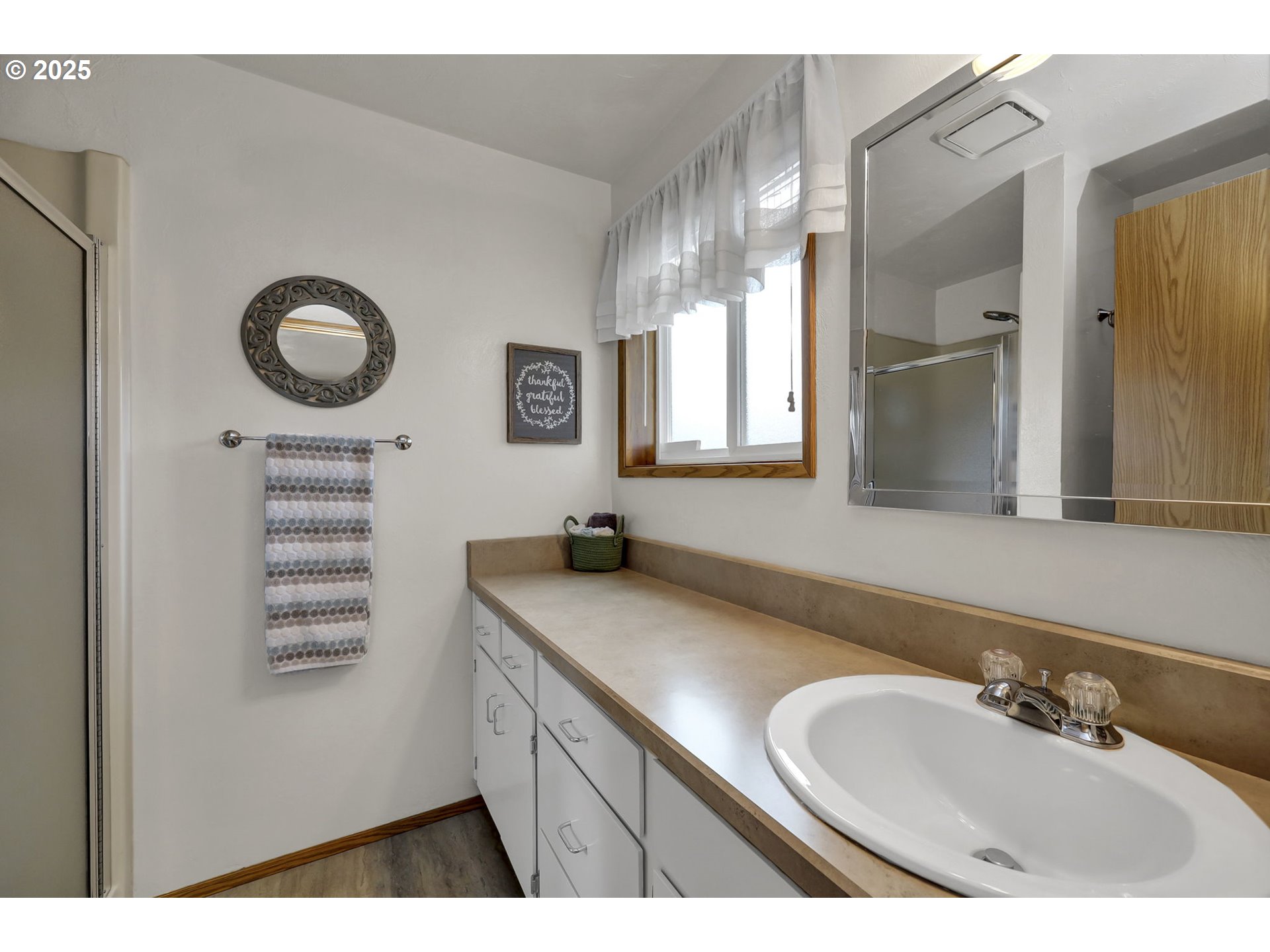 3670 Plumtree Drive Eugene, OR 97402 - Photo 28 of 47 a bathroom with a granite countertop double vanity sink and a mirror