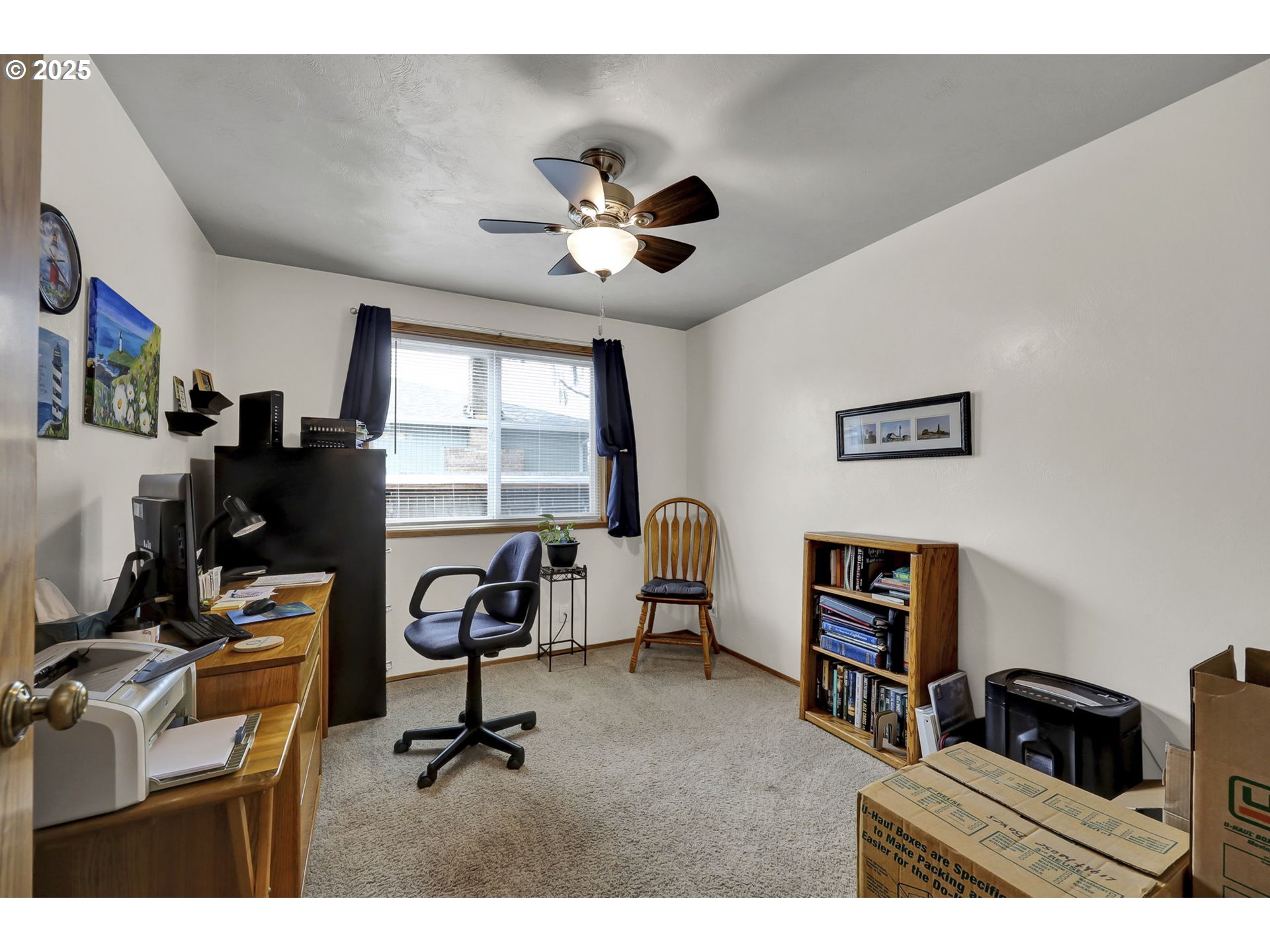 3670 Plumtree Drive Eugene, OR 97402 - Photo 29 of 47 a view of a workspace with furniture and a window