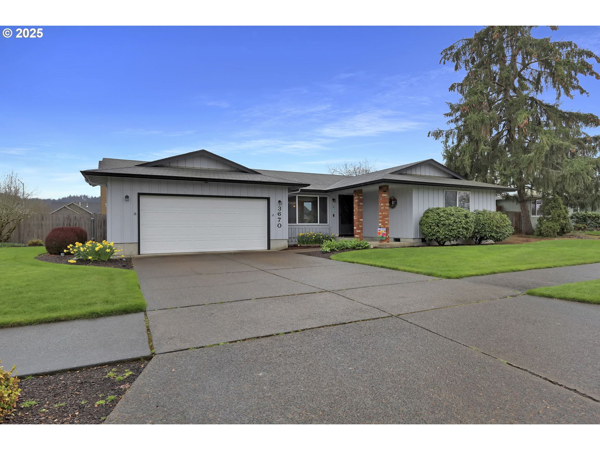 3670 Plumtree Drive Eugene, OR 97402 - Photo 3 of 47 a front view of a house with a garden