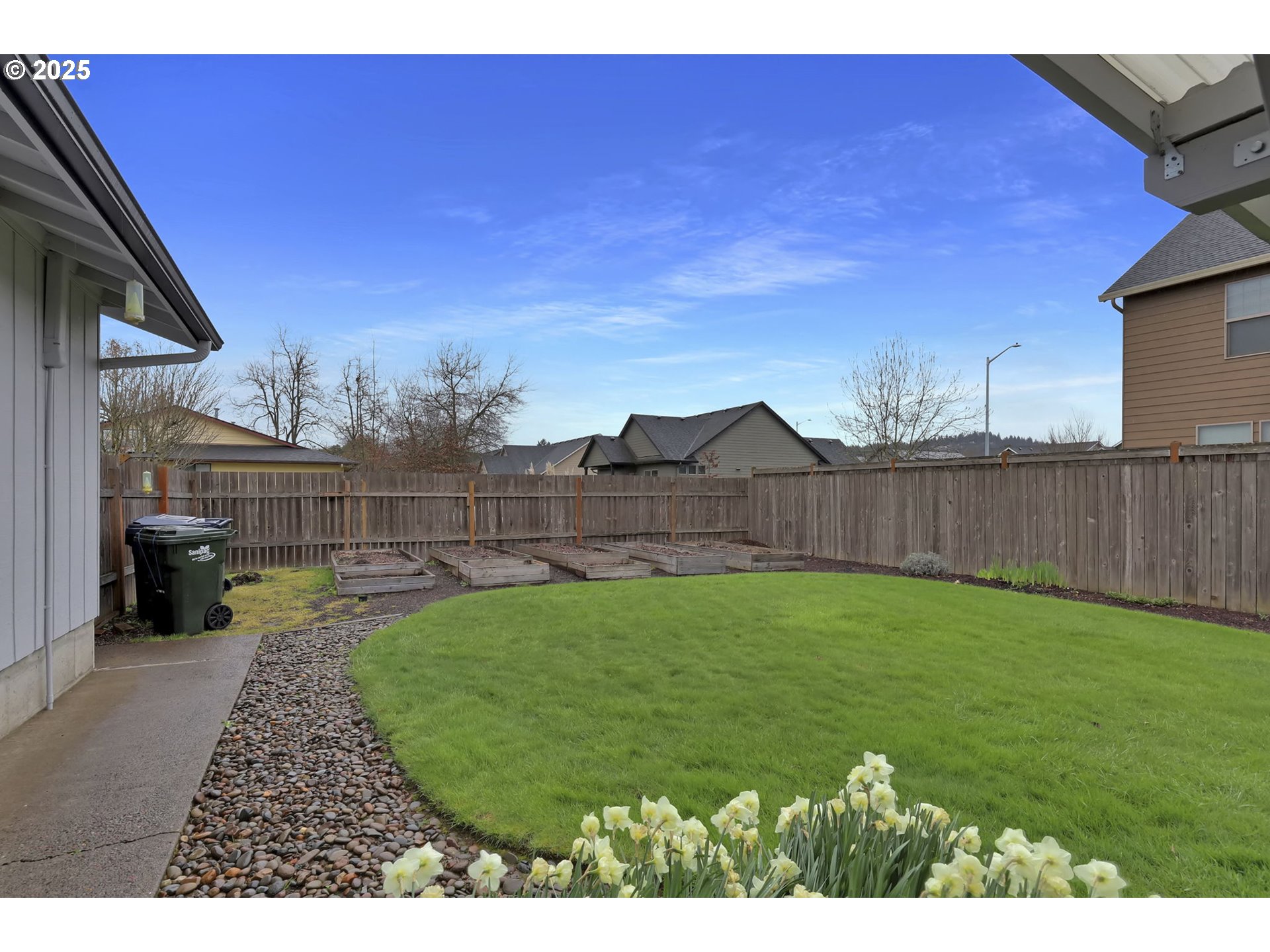 3670 Plumtree Drive Eugene, OR 97402 - Photo 40 of 47 a view of a backyard with wooden fence