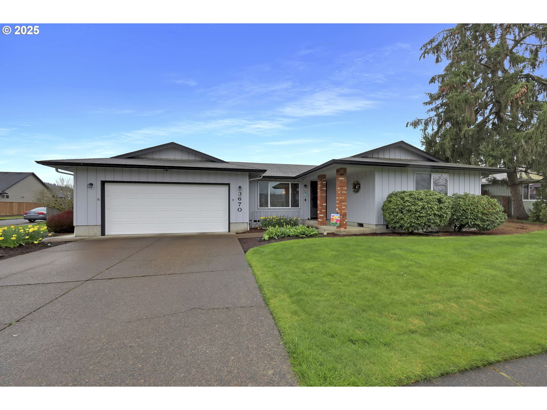 3670 Plumtree Drive Eugene, OR 97402 - Photo 4 of 47 a front view of a house with a garden