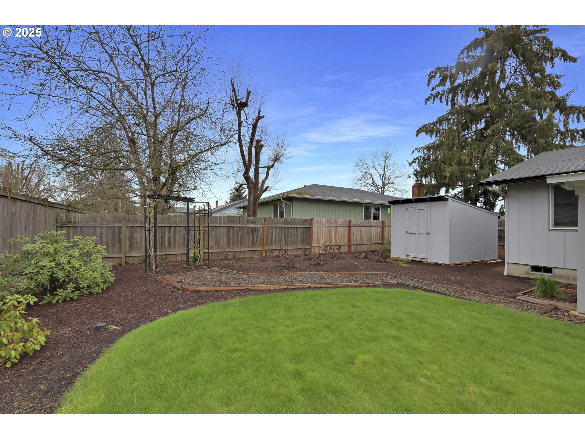 3670 Plumtree Drive Eugene, OR 97402 - Photo 44 of 47 a front view of a house with a garden