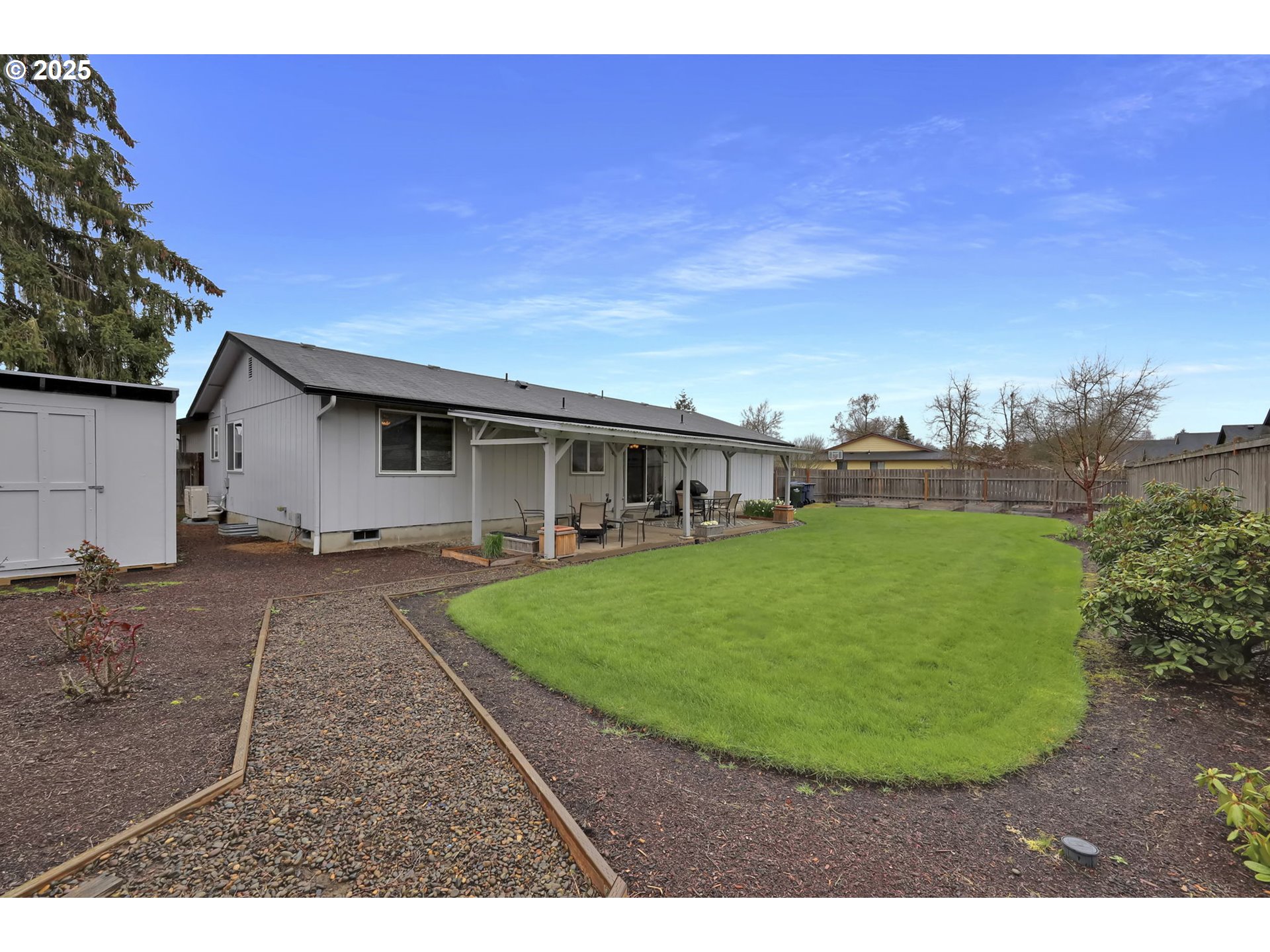 3670 Plumtree Drive Eugene, OR 97402 - Photo 46 of 47 a view of a white house with a big yard plants and large trees