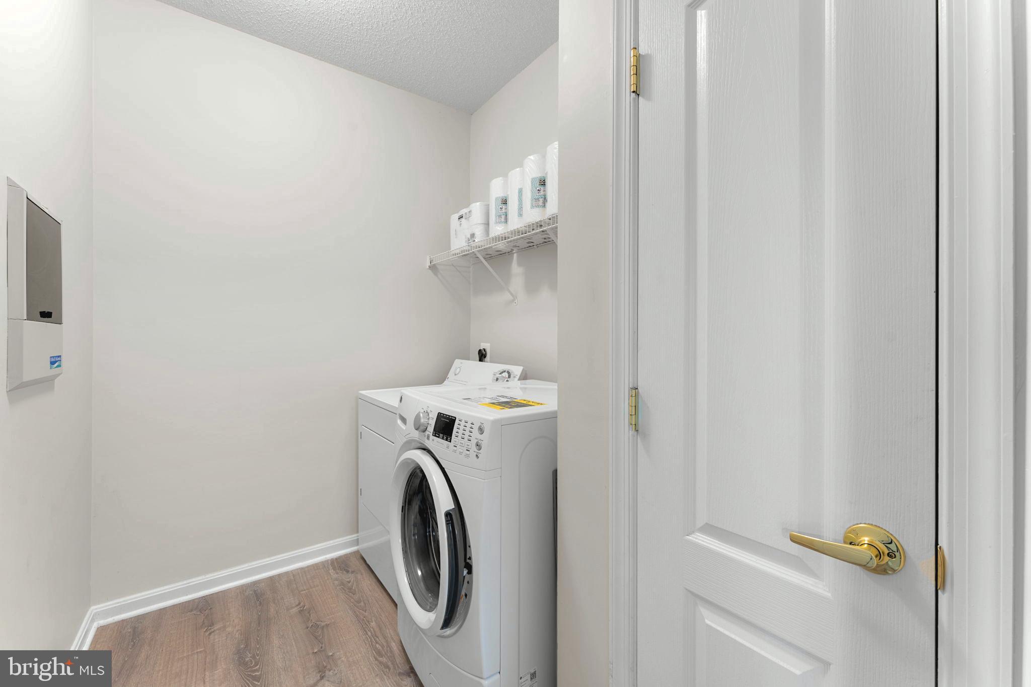 12170 Abington Hall Place, Unit 201 Reston, VA 20190 - Photo 12 of 39 a utility room with dryer and washer