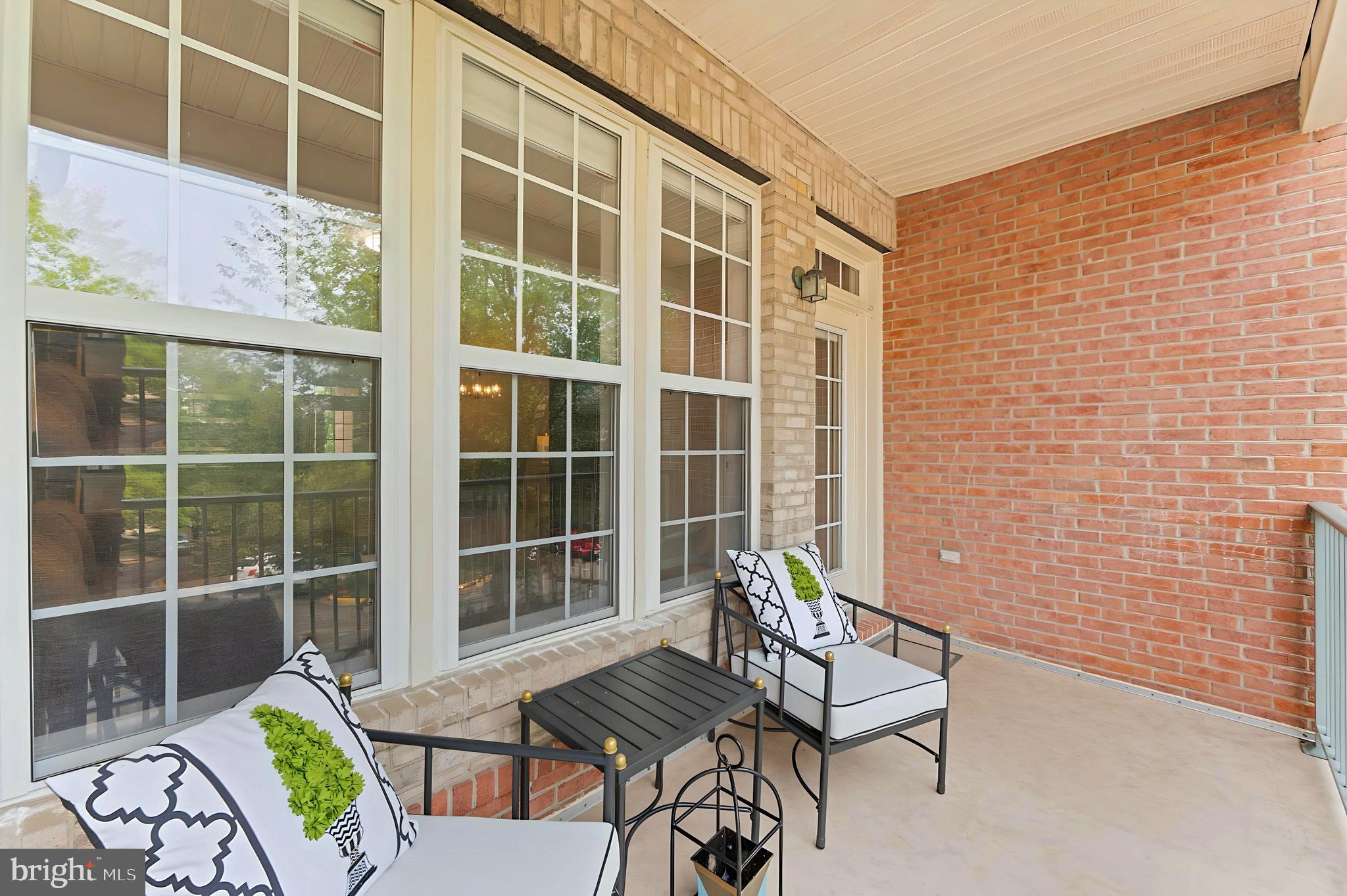 12170 Abington Hall Place, Unit 201 Reston, VA 20190 - Photo 2 of 39 a view of a chairs and table in patio