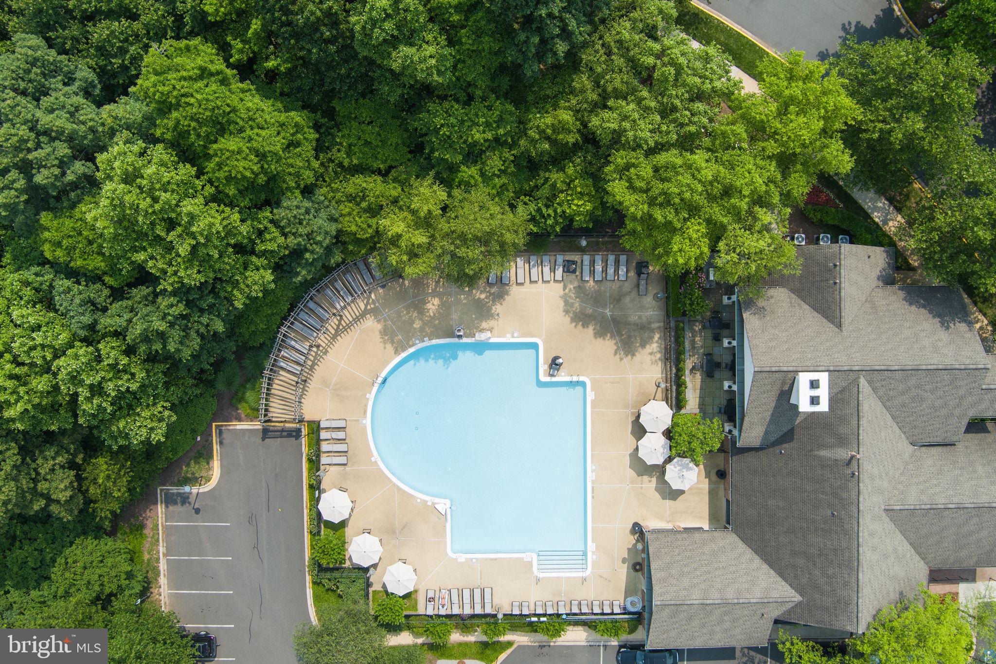 12170 Abington Hall Place, Unit 201 Reston, VA 20190 - Photo 31 of 39 an aerial view of a house with outdoor space and trees all around