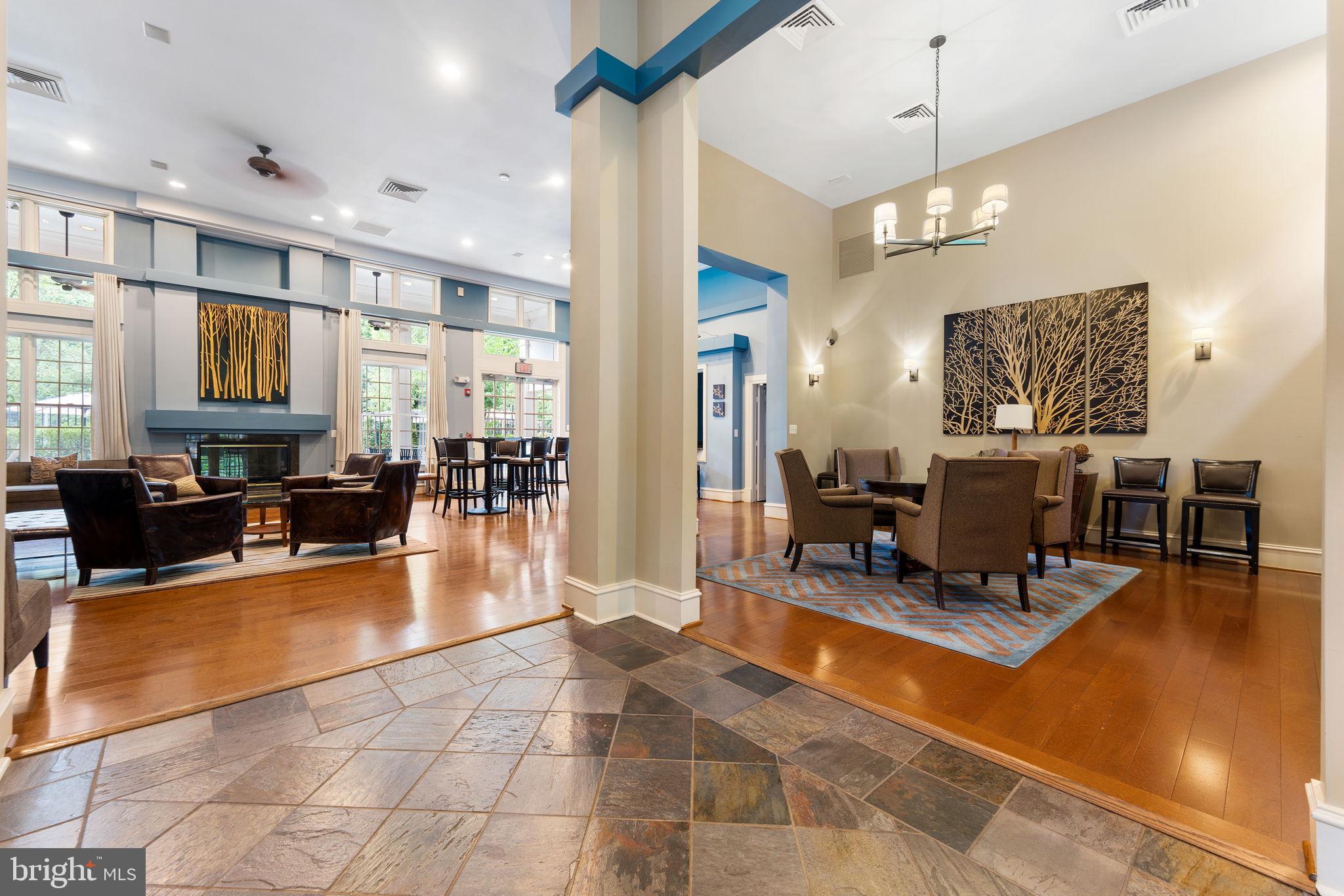 12170 Abington Hall Place, Unit 201 Reston, VA 20190 - Photo 32 of 39 a lobby with furniture and a chandelier