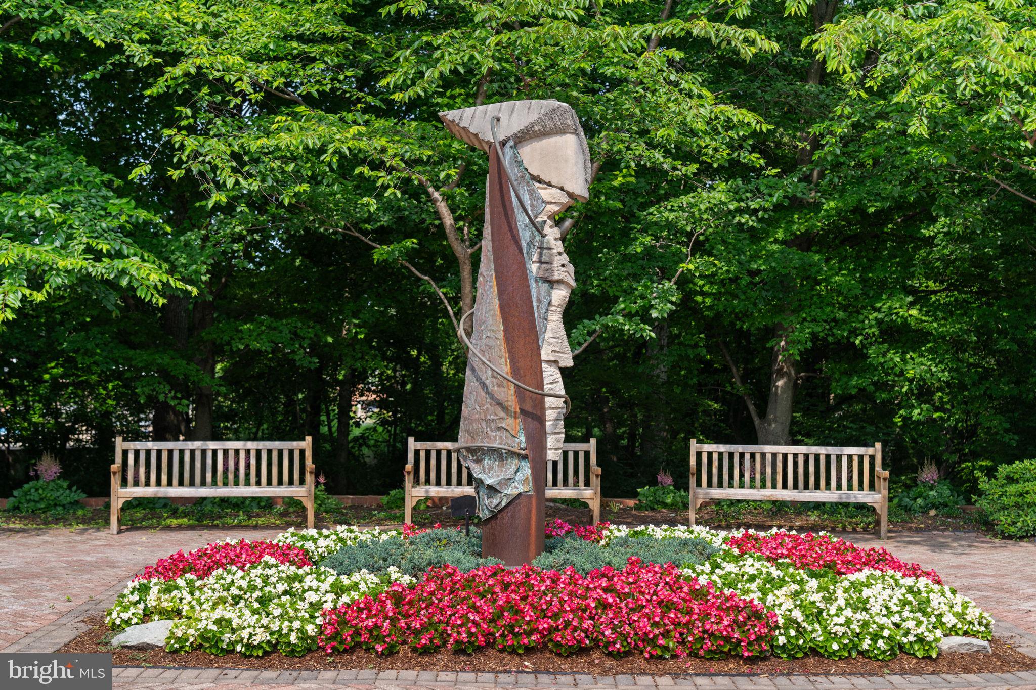 12170 Abington Hall Place, Unit 201 Reston, VA 20190 - Photo 36 of 39 a view of a garden with wooden fence