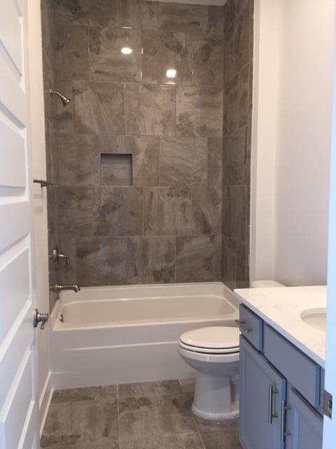 106 York Ln Inlet Beach, Unit C265 Inlet Beach, FL 32461 - Photo 9 of 19 a bathroom with a toilet and a bath tub