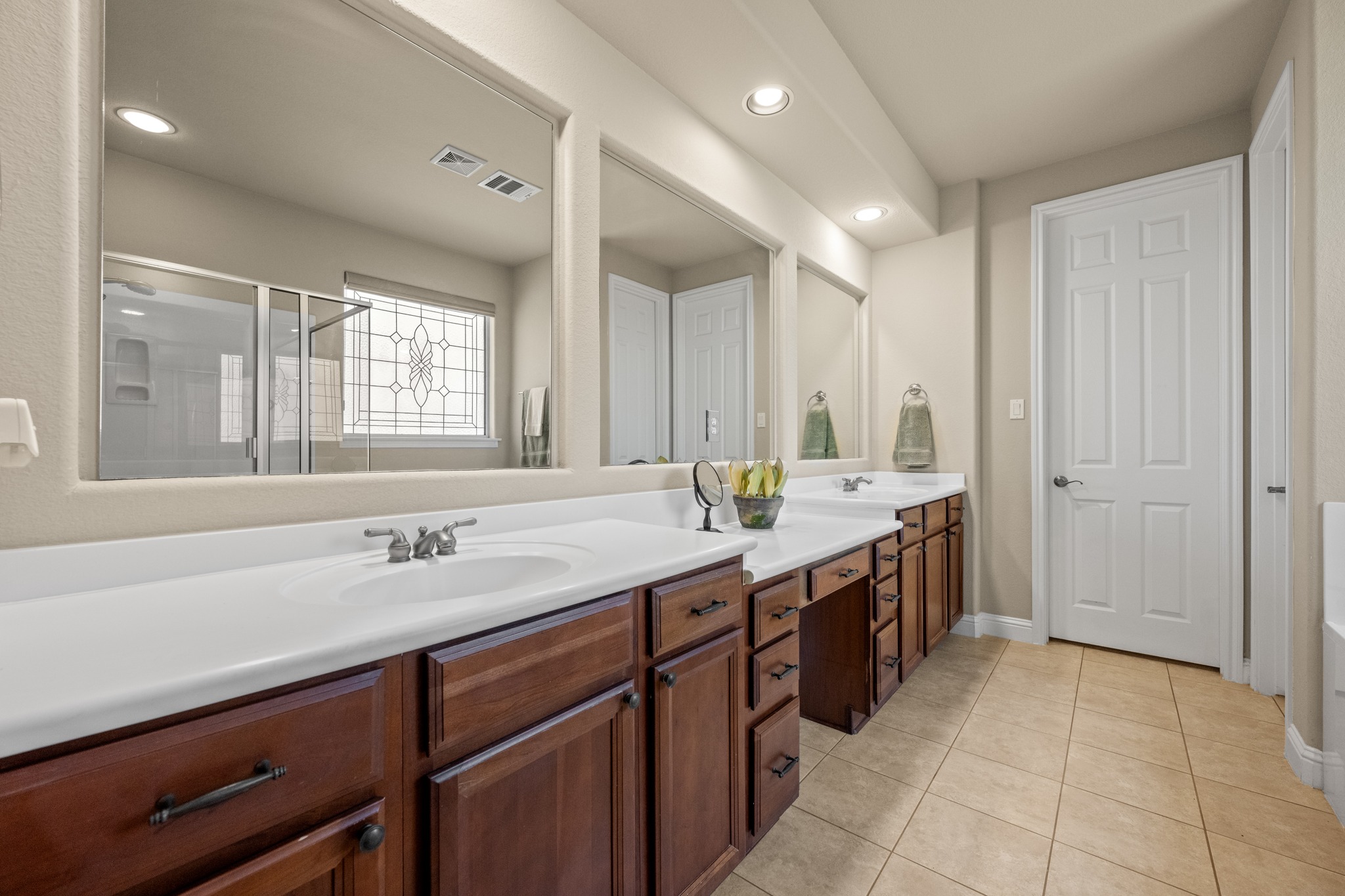14608 Spillman Ranch Loop Austin, TX 78738 - Photo 18 of 31 a spacious bathroom with a double vanity sink a mirror and a bathtub