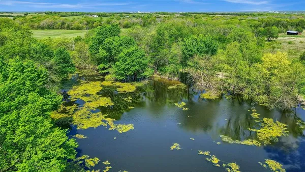 a view of a lake with a yard