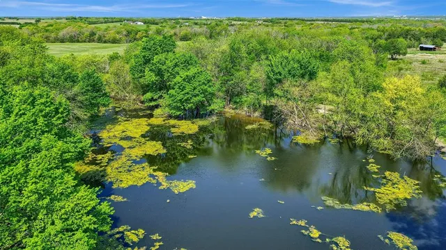 a view of a lake with a yard