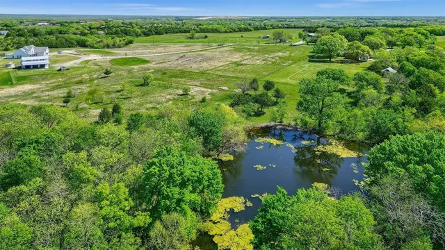 a view of a garden with a building