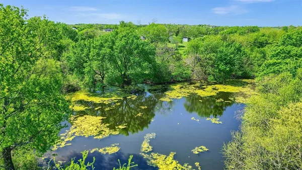view of a lake with a yard