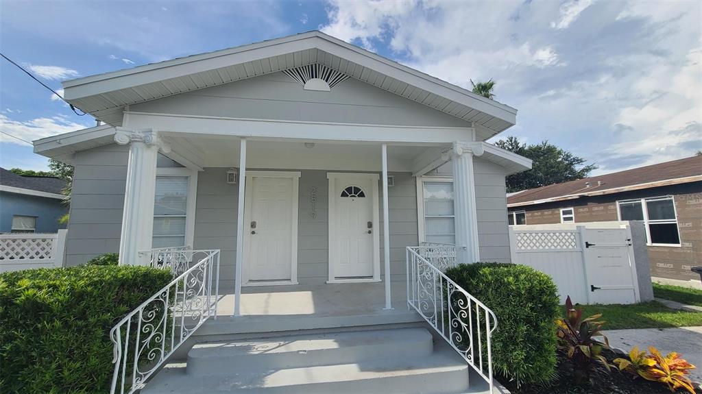 2519 West Walnut Street Tampa, FL 33607 - Photo 14 of 19 a view of a house with wooden fence