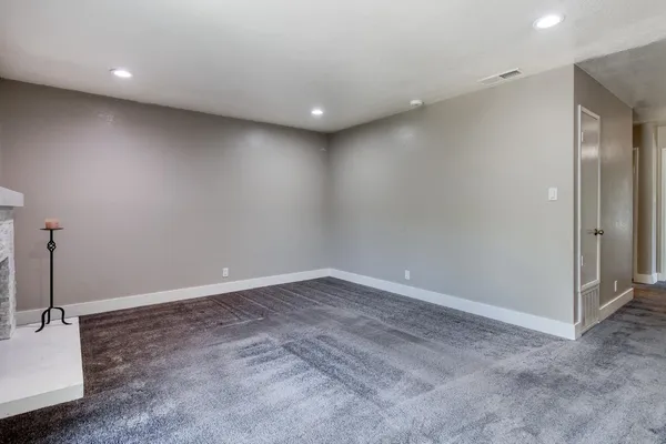an empty room with a bathroom