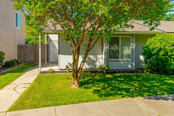 front view of a house with a yard