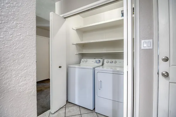 a utility room with washer and dryer
