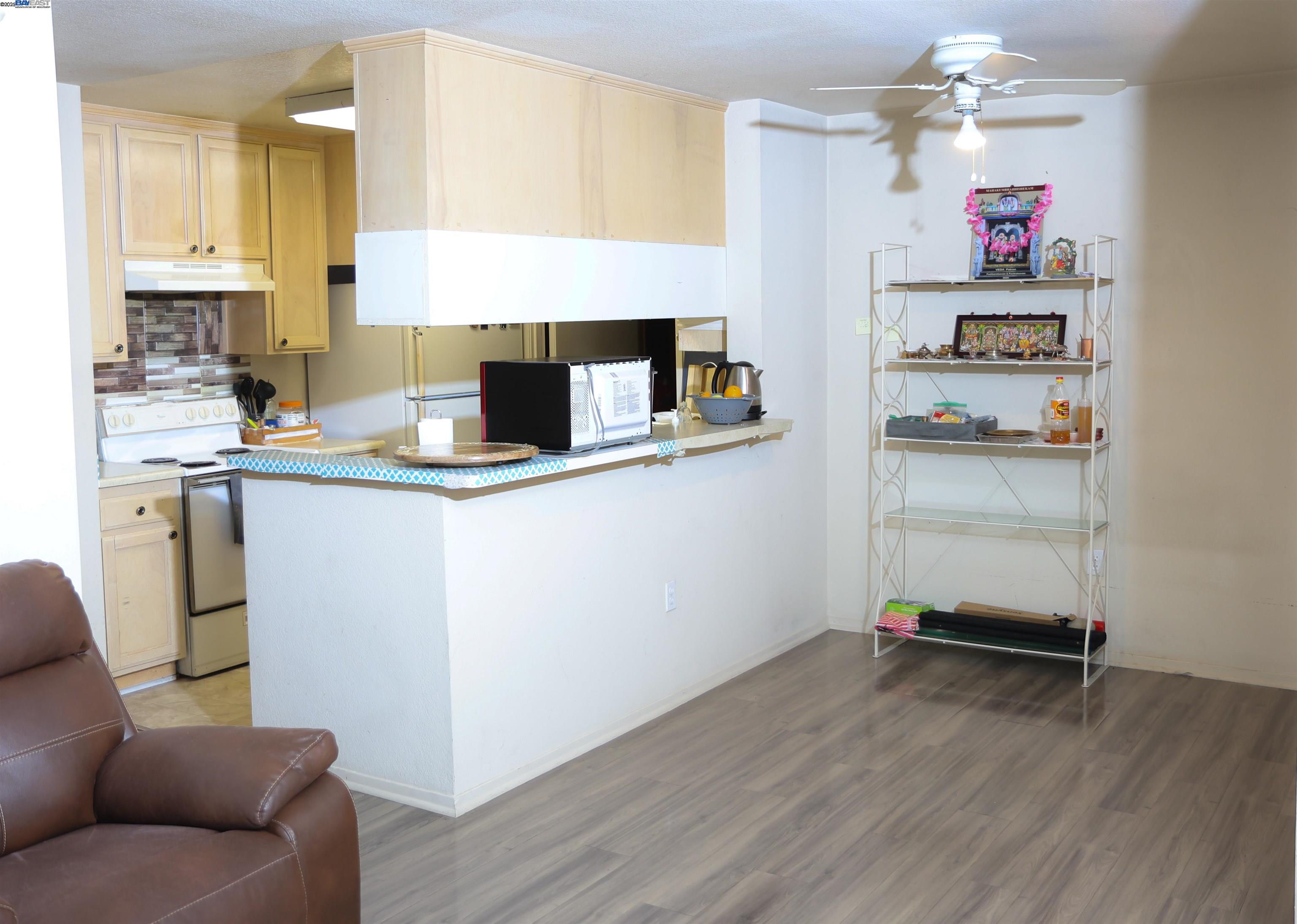 839 Printempo Place San Jose, CA 95134 - Photo 11 of 54 a kitchen with a refrigerator and a sink