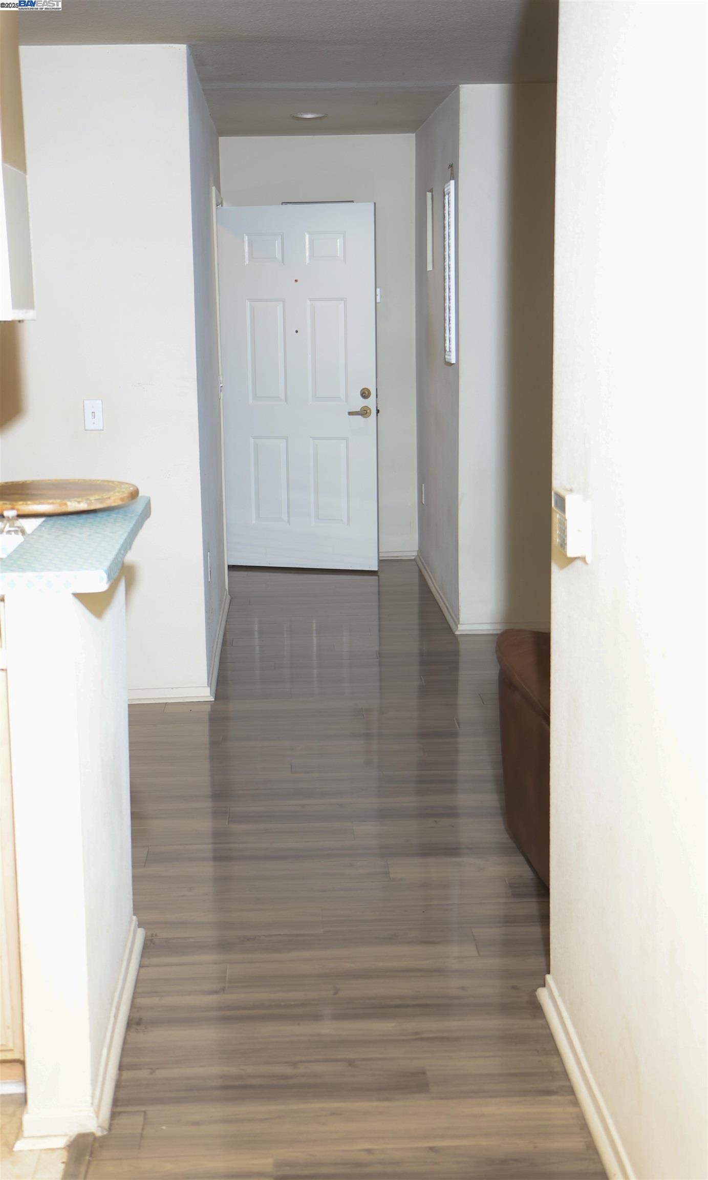839 Printempo Place San Jose, CA 95134 - Photo 13 of 54 a view of a hallway with wooden floor