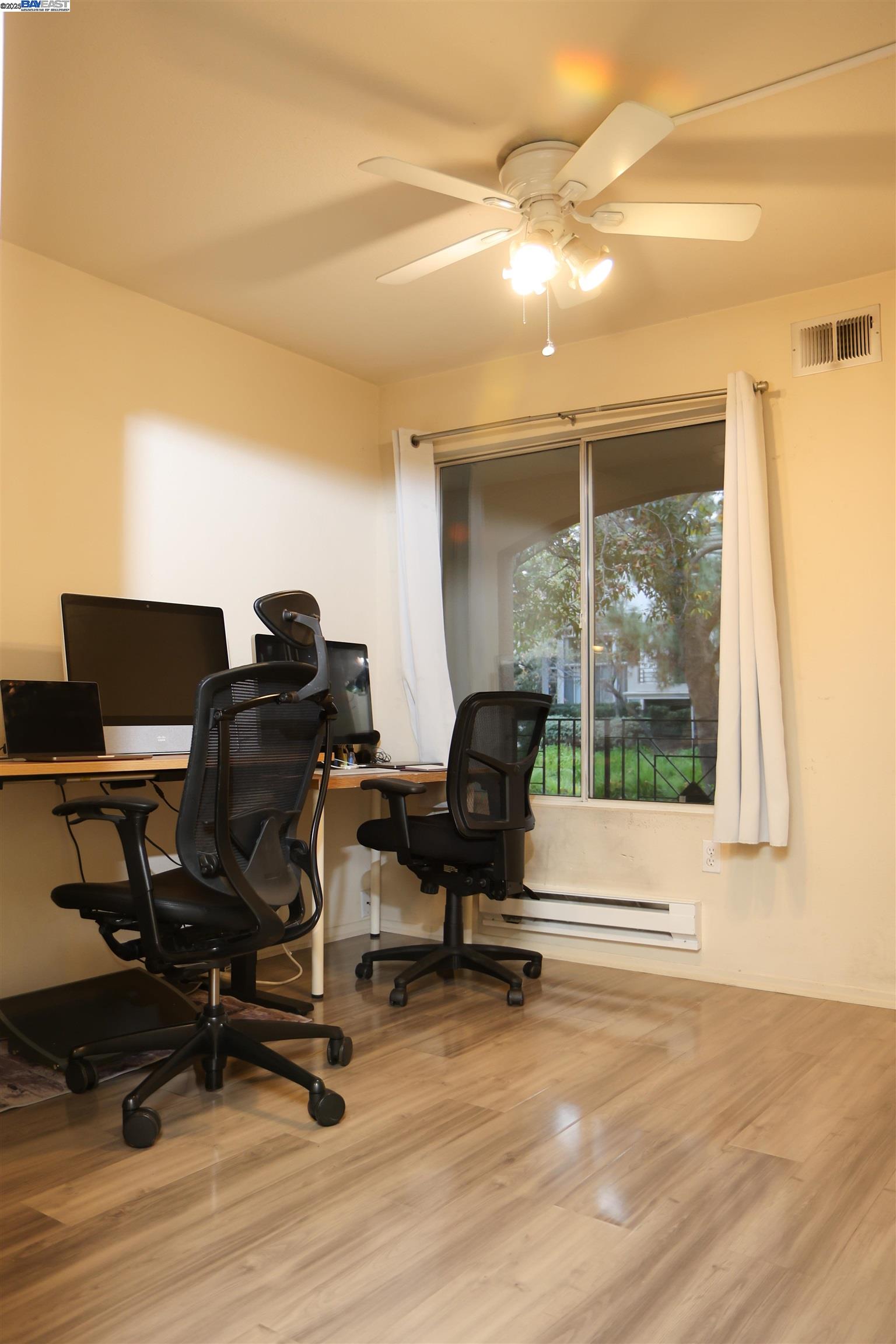 839 Printempo Place San Jose, CA 95134 - Photo 15 of 54 a view of workspace with wooden floor windows
