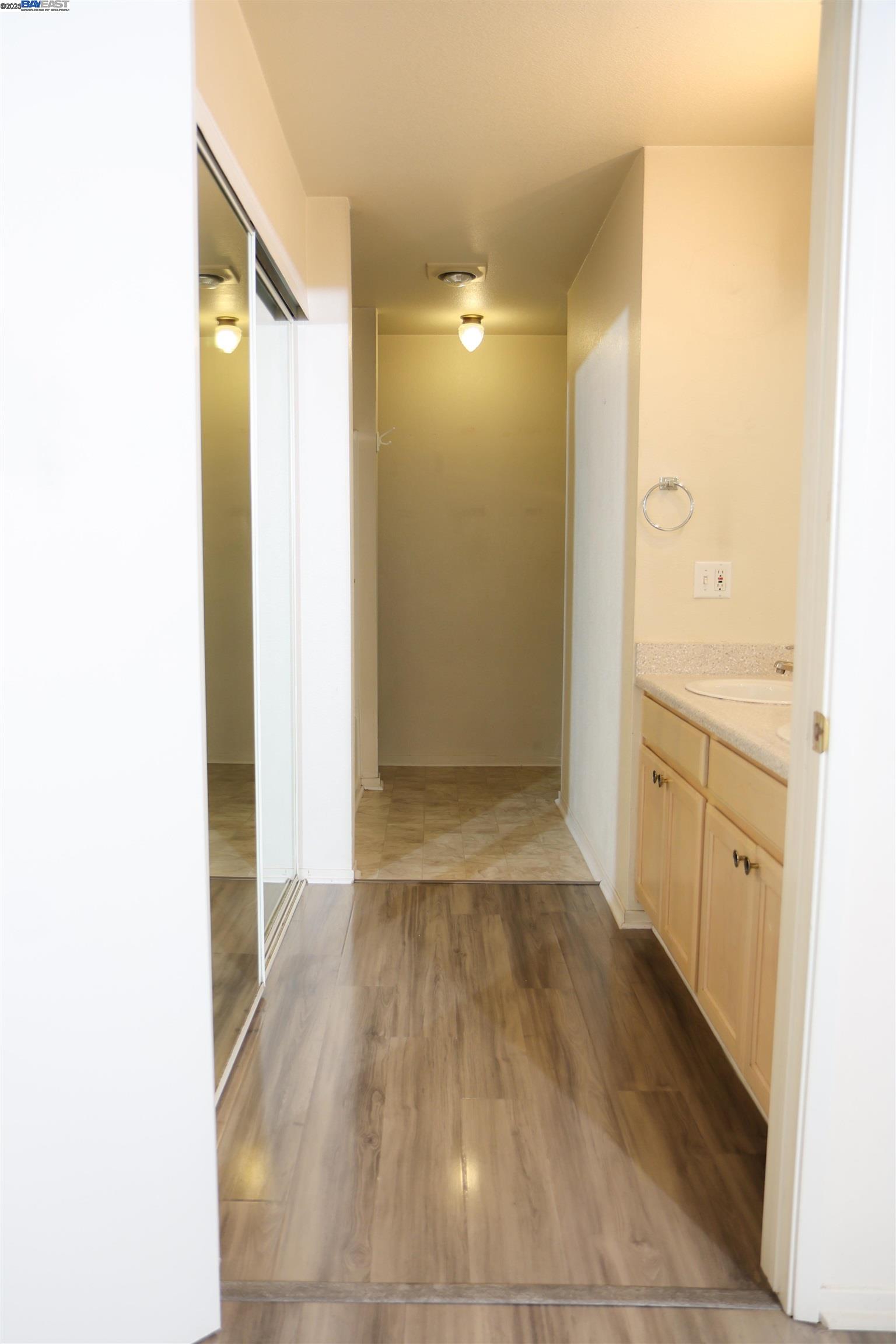 839 Printempo Place San Jose, CA 95134 - Photo 18 of 54 a view of a hallway with wooden floor