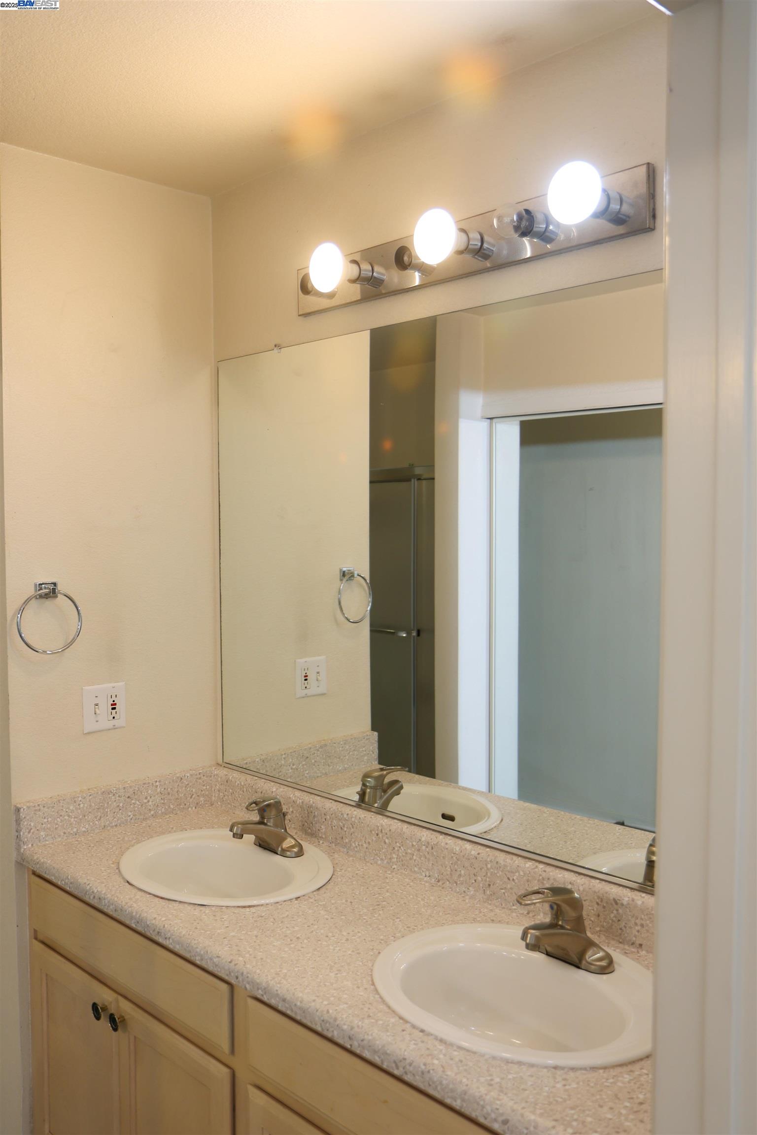 839 Printempo Place San Jose, CA 95134 - Photo 21 of 54 a bathroom with a sink and a mirror