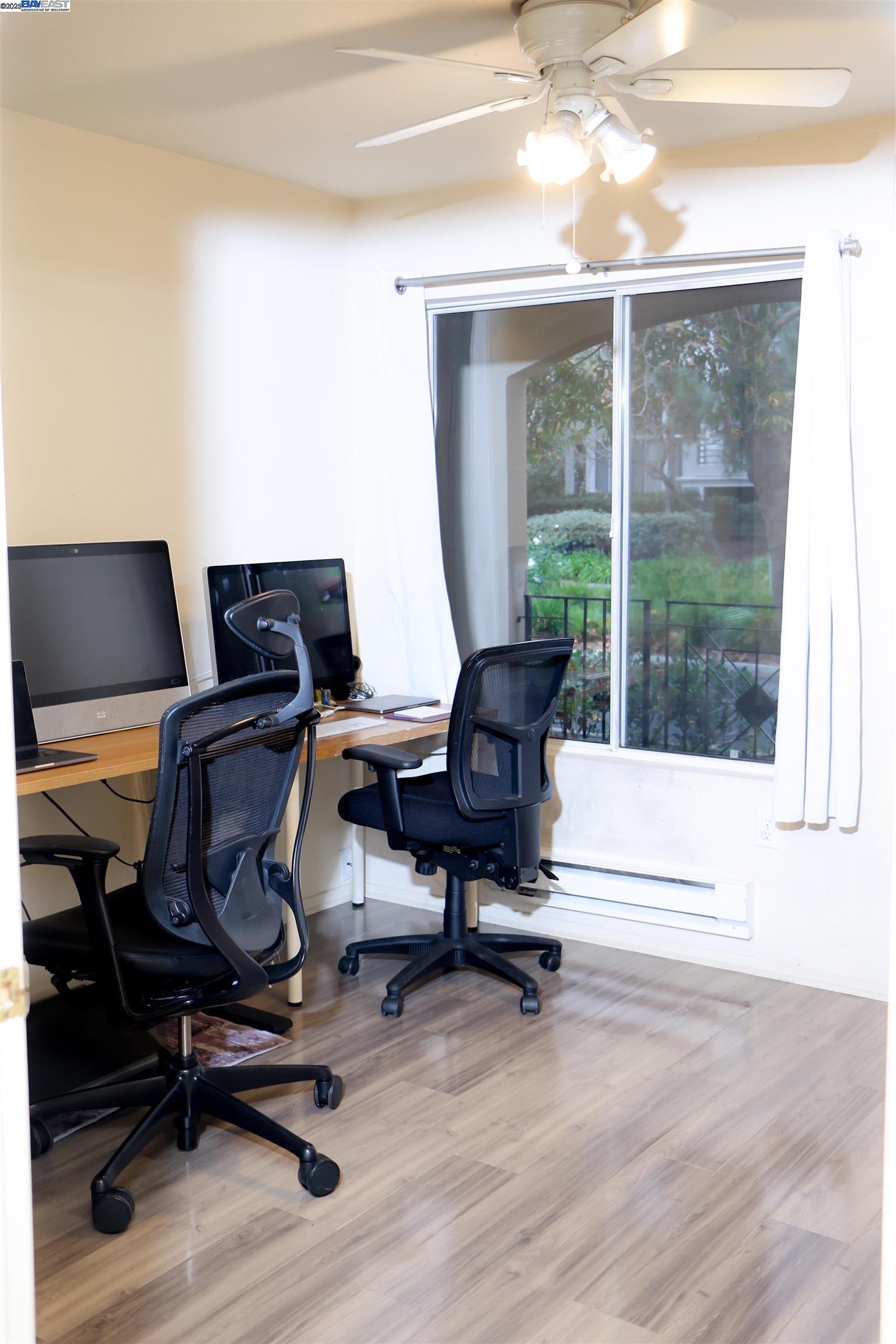 839 Printempo Place San Jose, CA 95134 - Photo 29 of 54 a view of workspace with wooden floor and windows