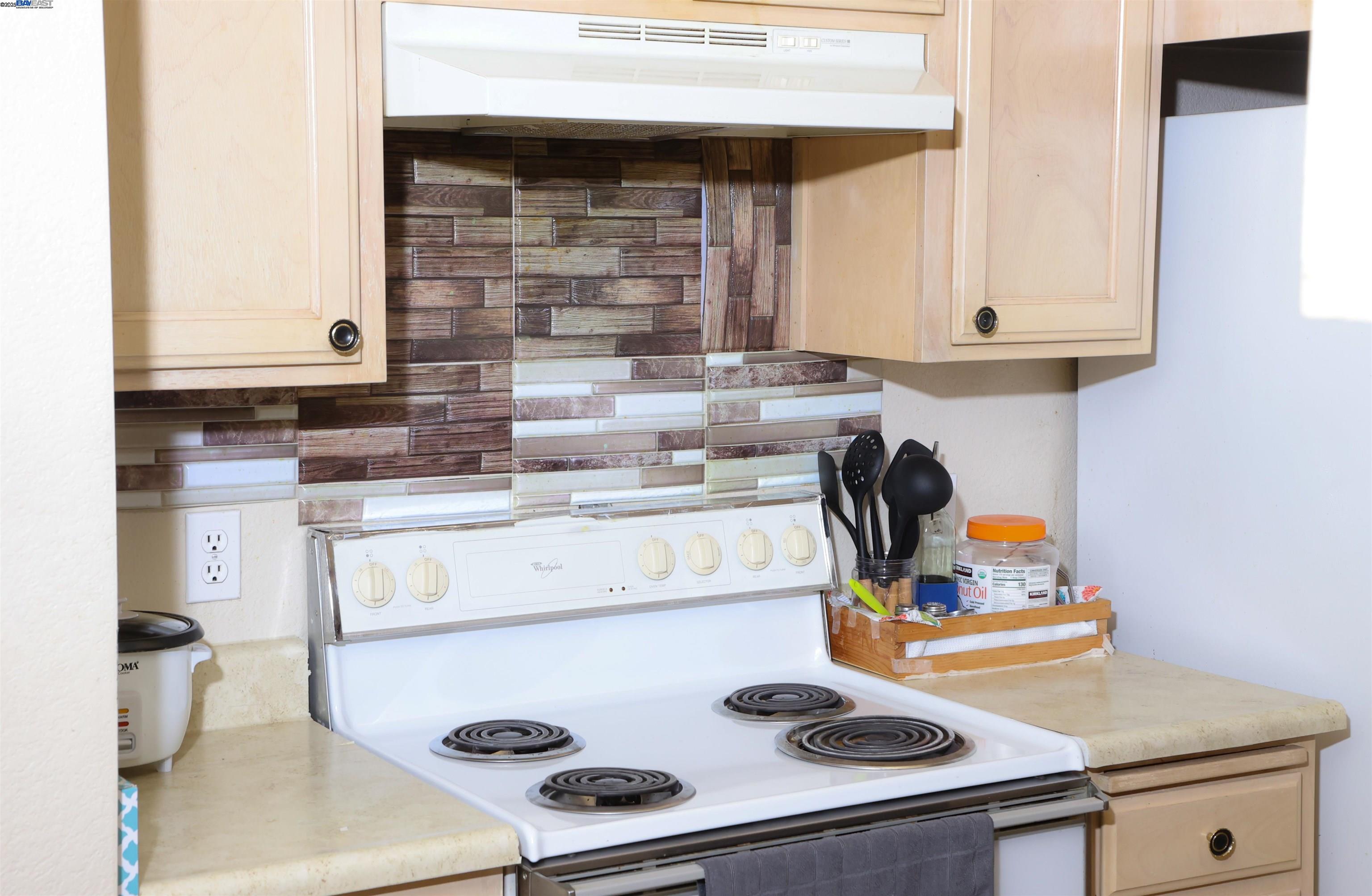 839 Printempo Place San Jose, CA 95134 - Photo 32 of 54 a kitchen with a stove and a microwave
