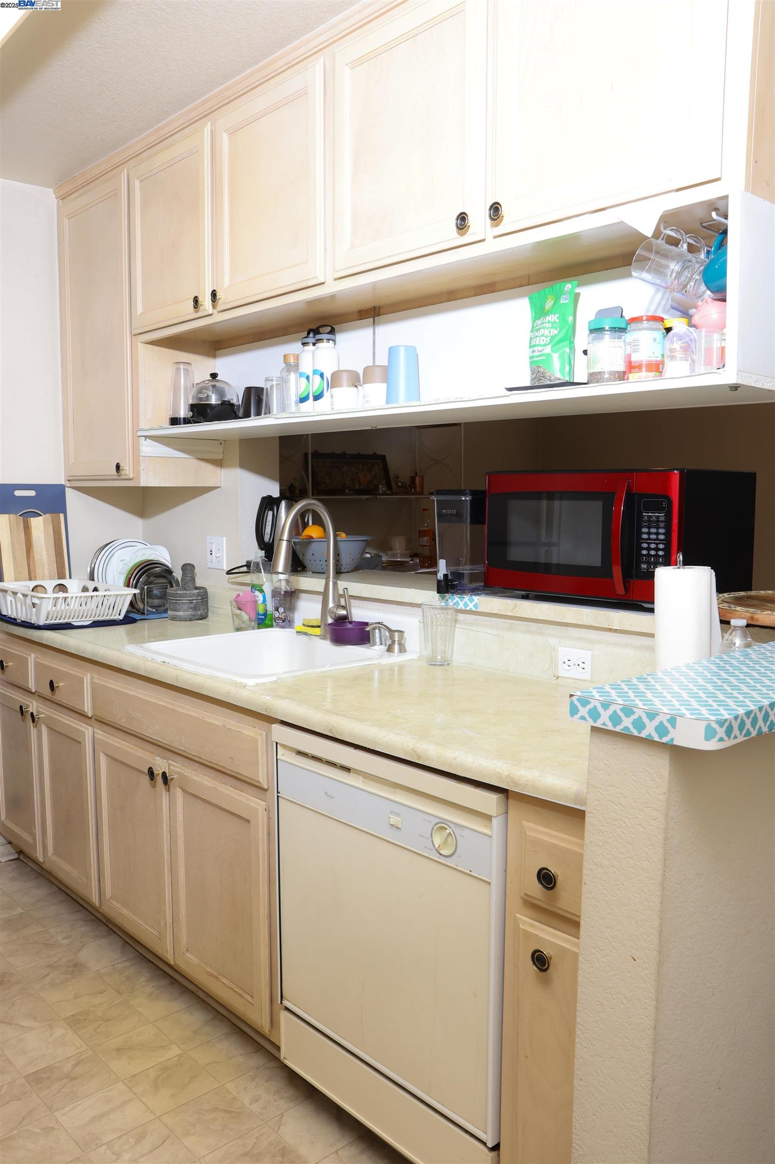 839 Printempo Place San Jose, CA 95134 - Photo 33 of 54 a kitchen with granite countertop a sink and cabinets