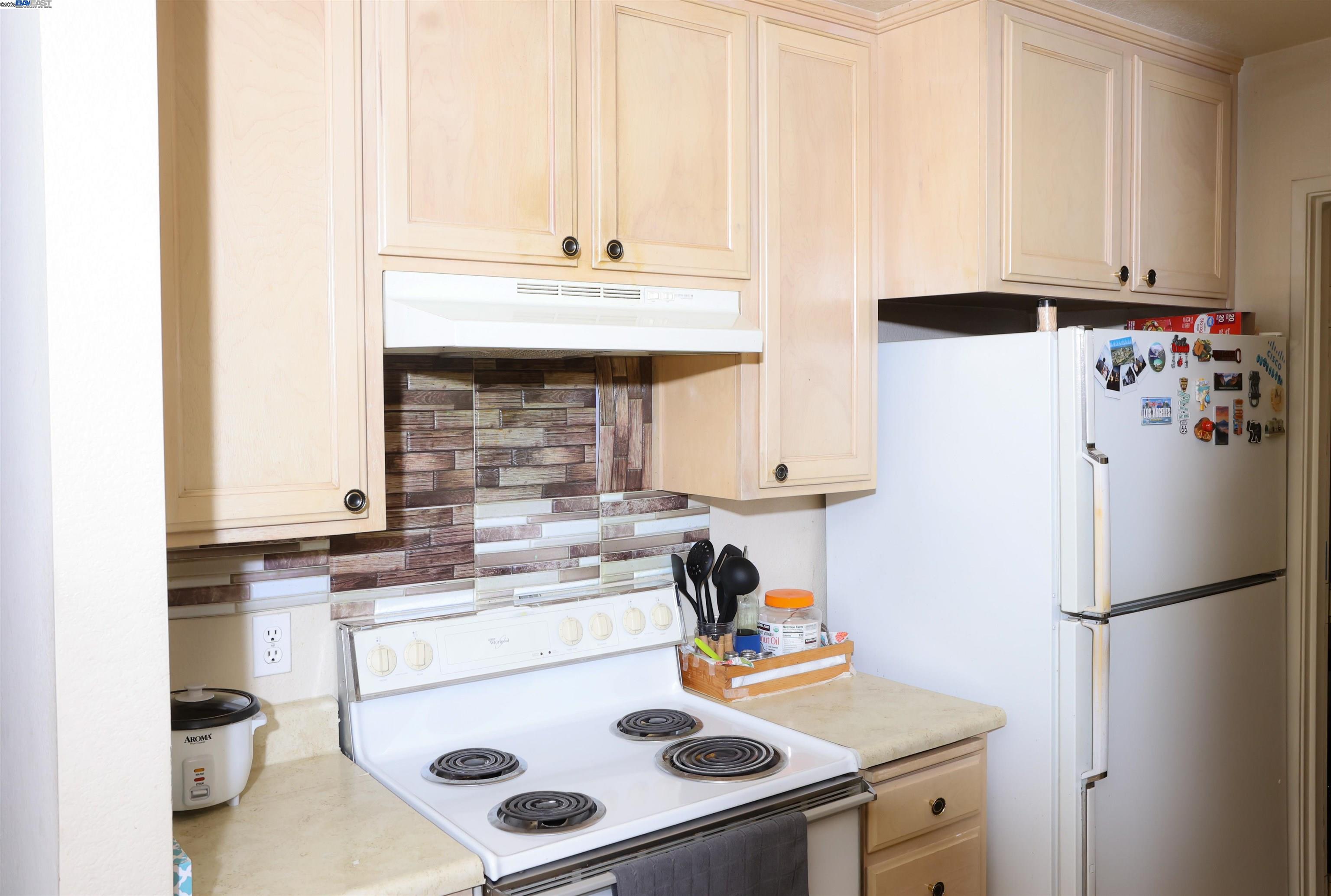 839 Printempo Place San Jose, CA 95134 - Photo 34 of 54 a kitchen with a refrigerator and a sink