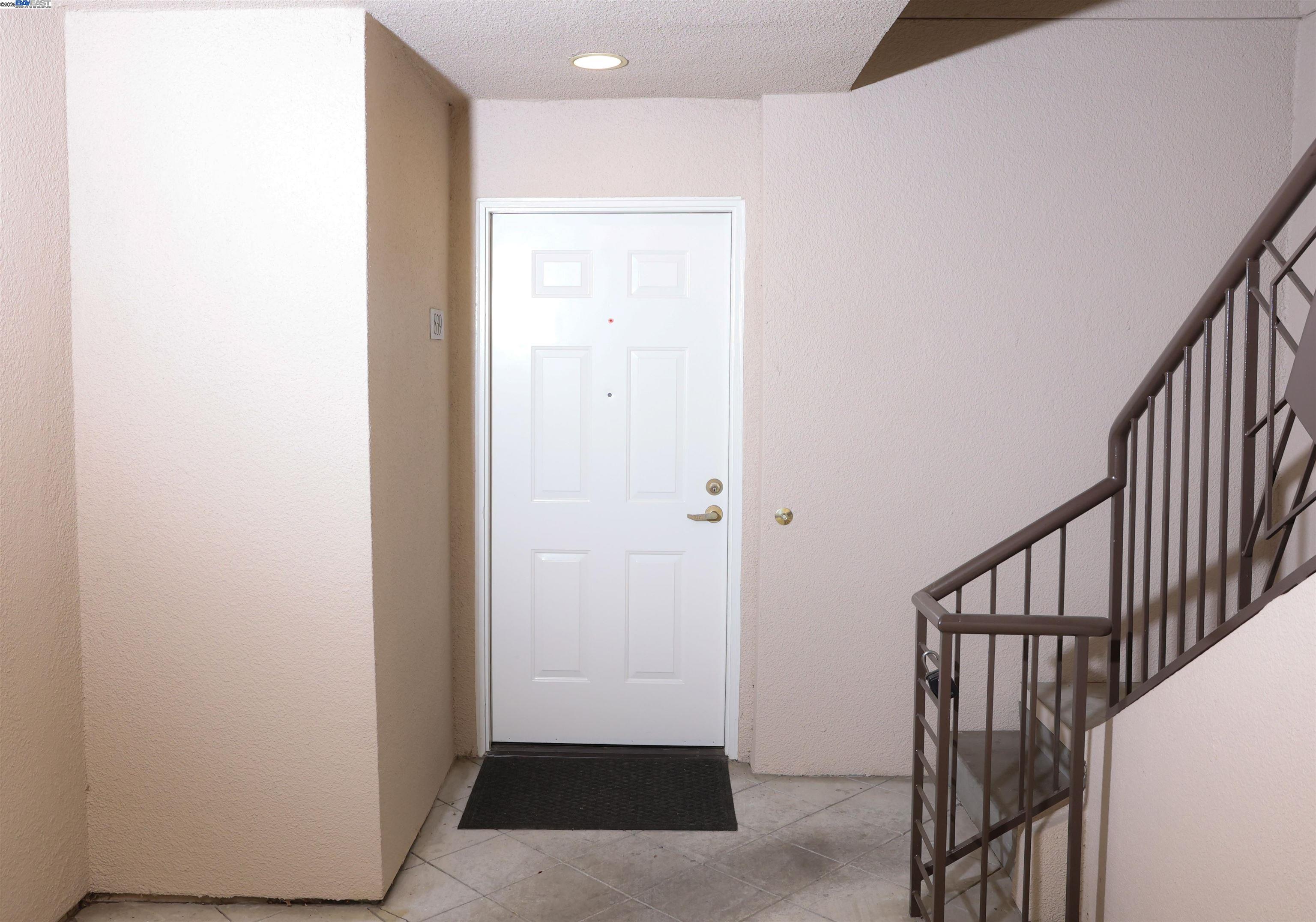 839 Printempo Place San Jose, CA 95134 - Photo 42 of 54 a view of a hallway with wooden floor and entryway