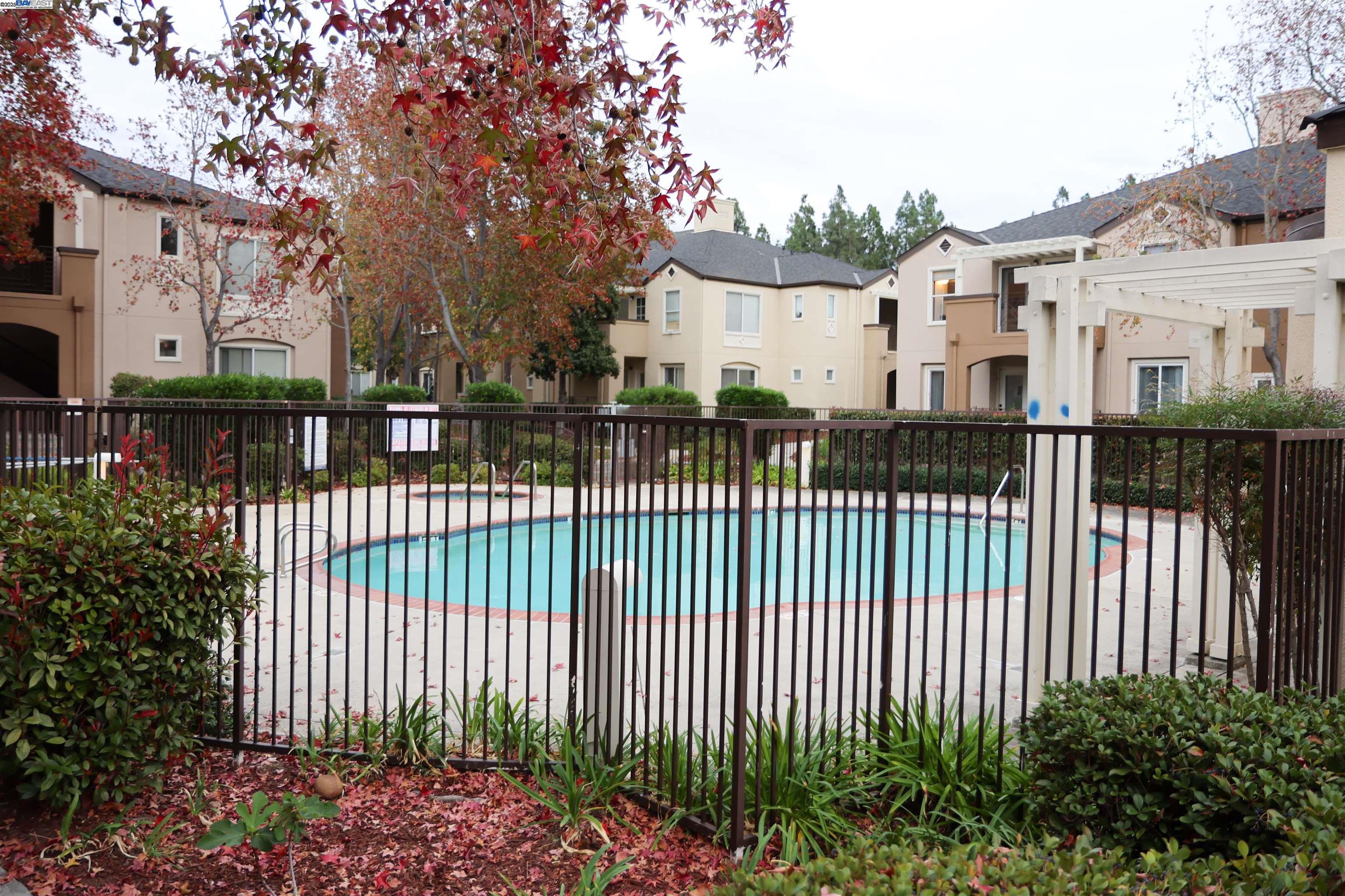 839 Printempo Place San Jose, CA 95134 - Photo 52 of 54 a view of a white house with a small yard and plants