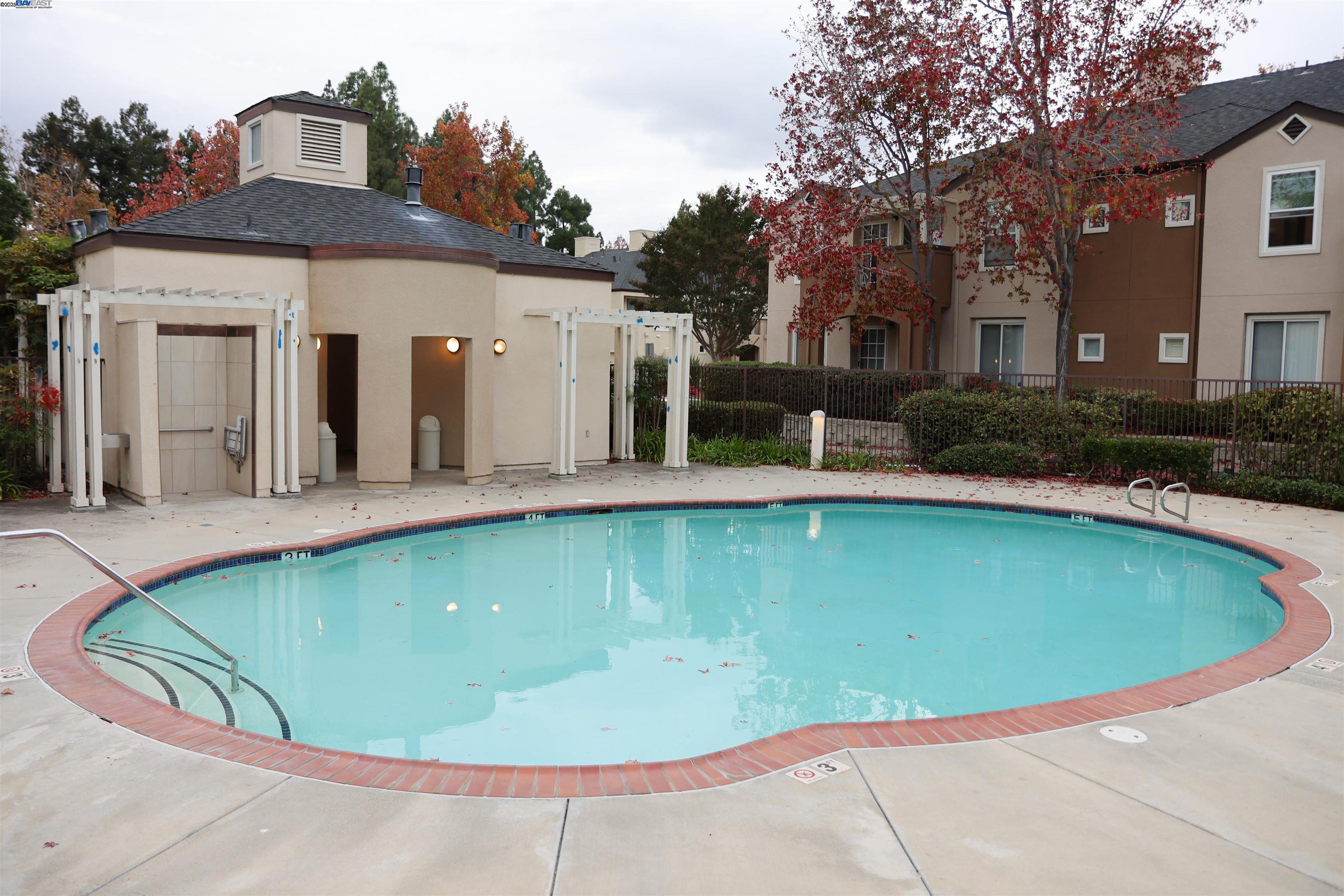 839 Printempo Place San Jose, CA 95134 - Photo 53 of 54 a view of a swimming pool with a yard