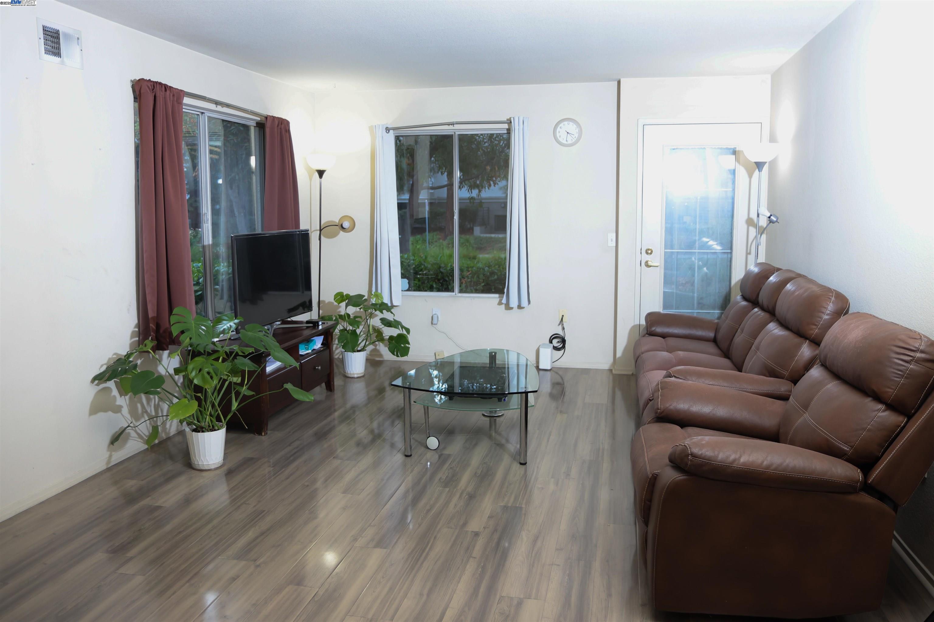 839 Printempo Place San Jose, CA 95134 - Photo 7 of 54 a living room with furniture potted plant and a window