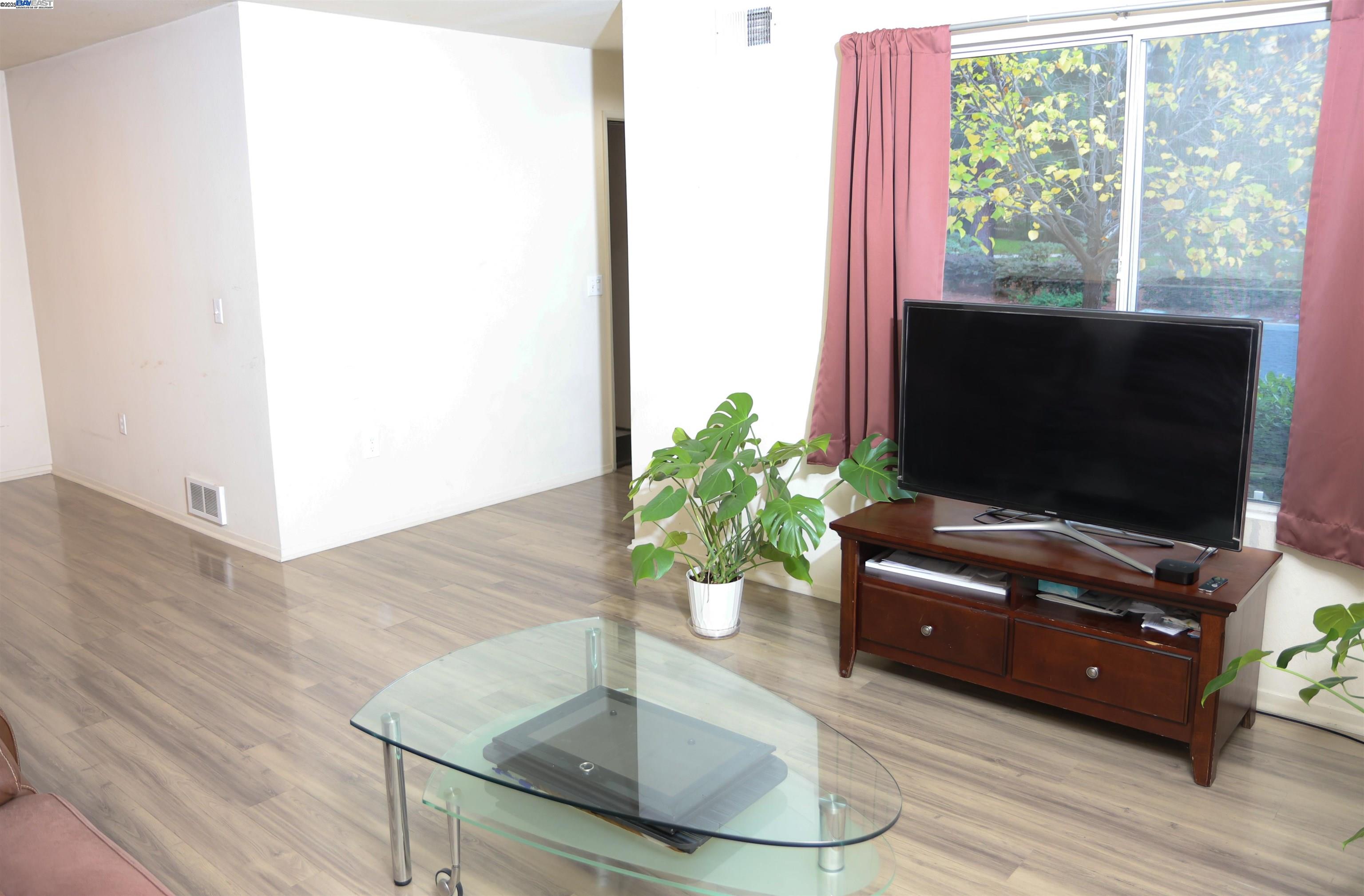 839 Printempo Place San Jose, CA 95134 - Photo 9 of 54 a living room with furniture and a flat screen tv