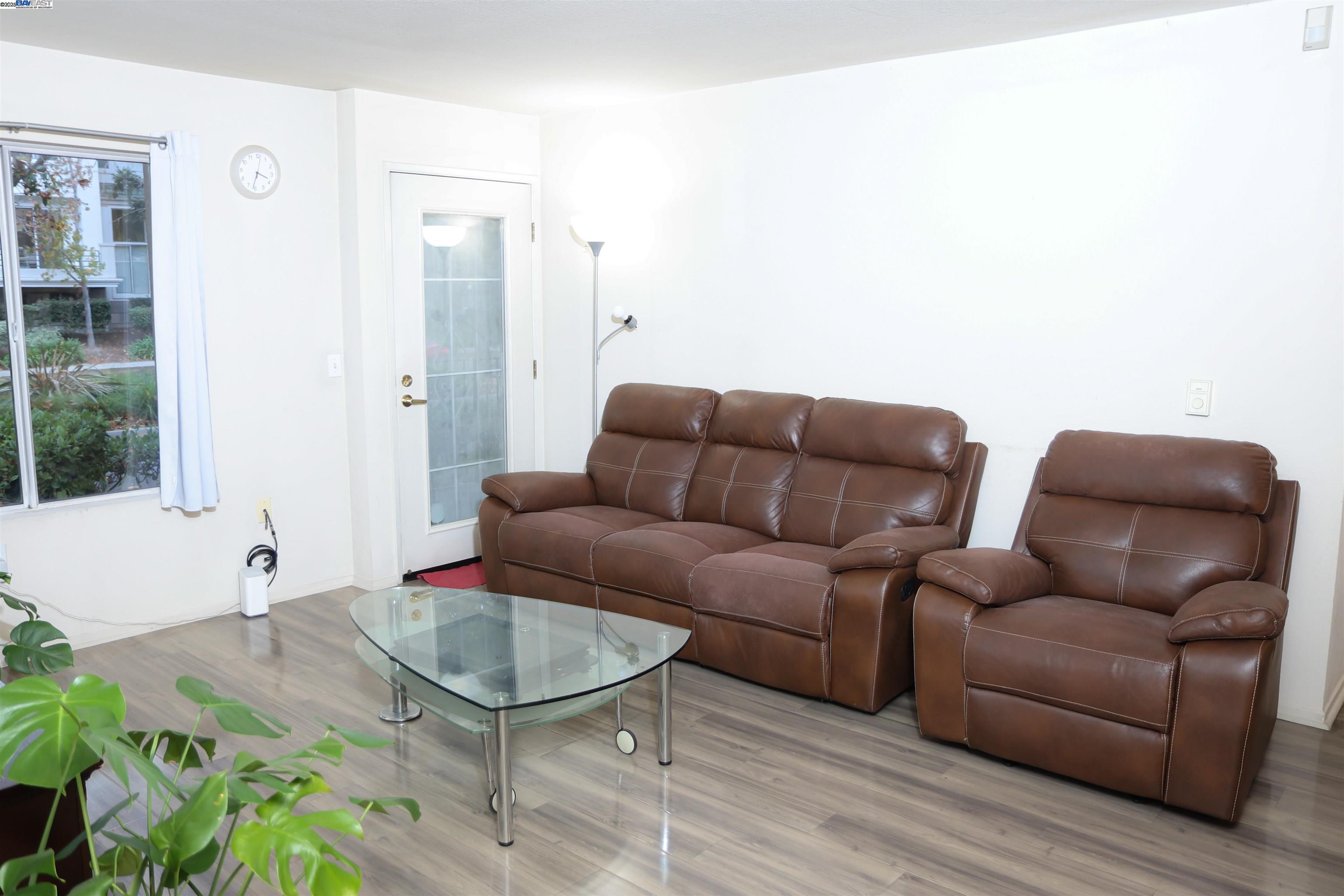 839 Printempo Place San Jose, CA 95134 - Photo 10 of 54 a living room with furniture and a potted plant