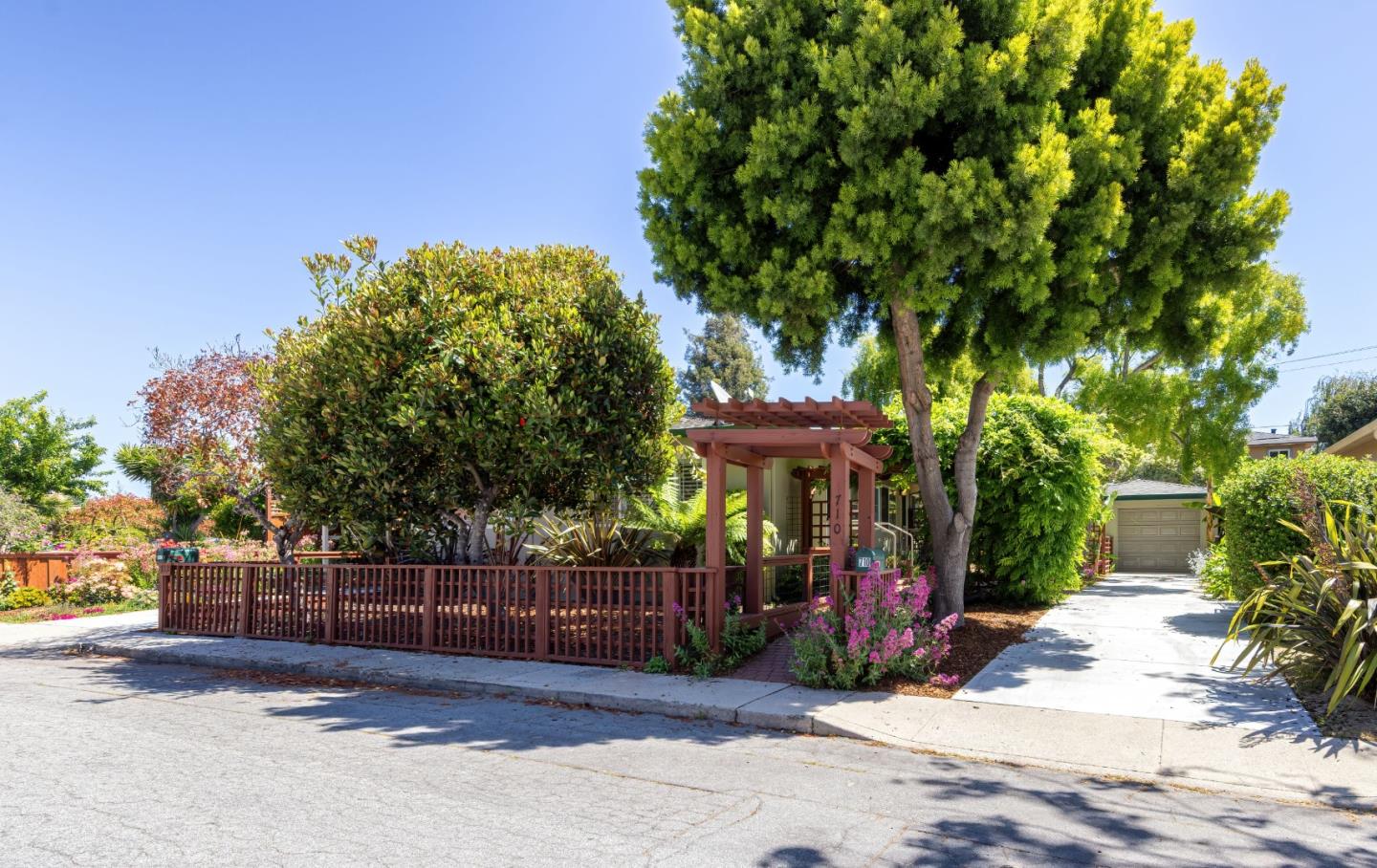 710-712 Riverview Drive Capitola, CA 95010 - Photo 1 of 37 a view of a park with iron fence