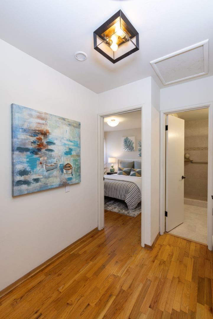 710-712 Riverview Drive Capitola, CA 95010 - Photo 11 of 37 a view of a bedroom with wooden floor and bedroom
