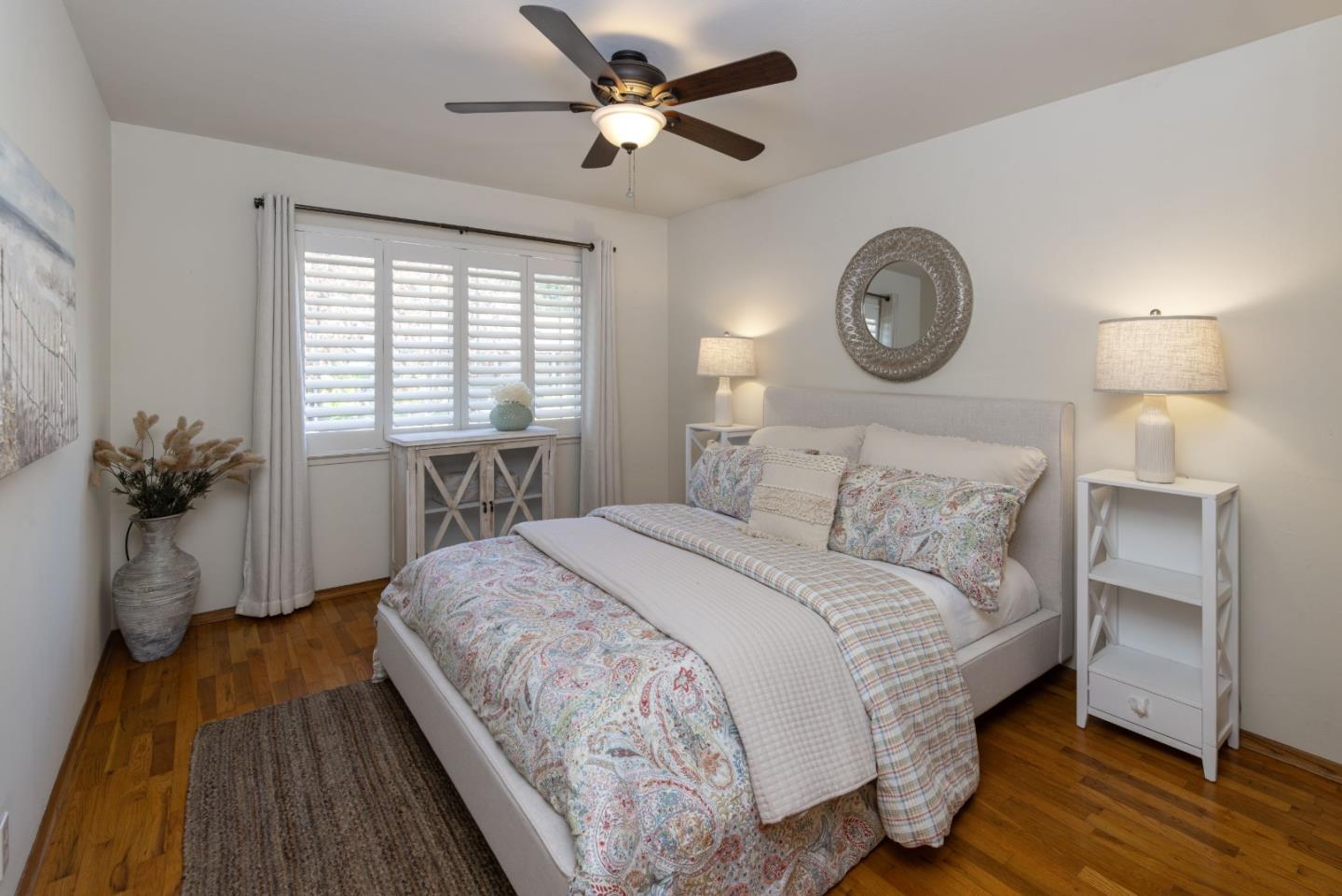 710-712 Riverview Drive Capitola, CA 95010 - Photo 13 of 37 a bedroom with a bed and a chandelier