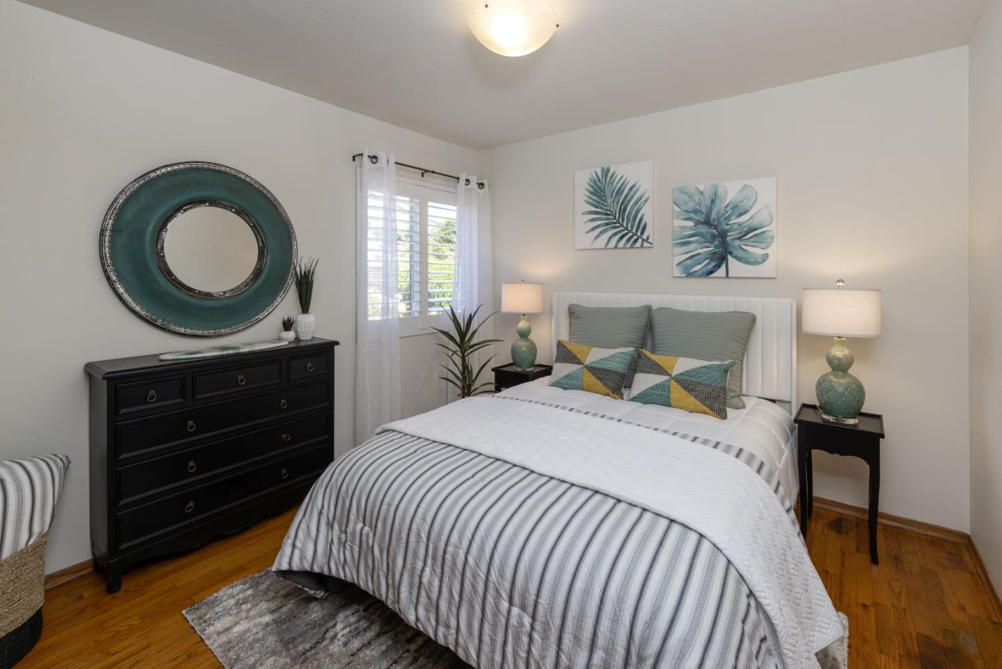 710-712 Riverview Drive Capitola, CA 95010 - Photo 14 of 37 a bedroom with a bed and a table