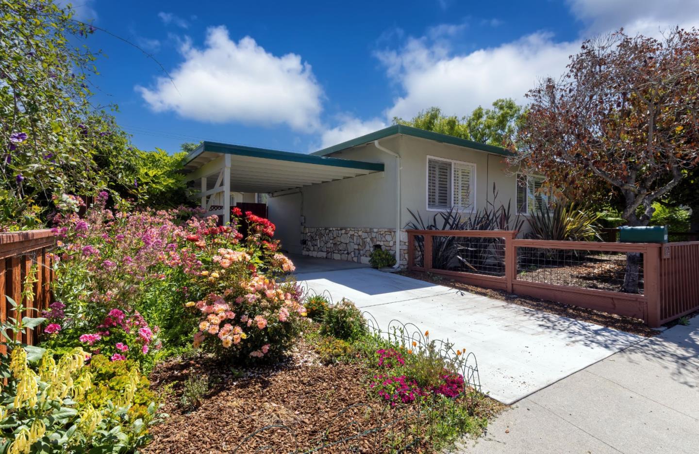 710-712 Riverview Drive Capitola, CA 95010 - Photo 18 of 37 a view of a backyard with potted plants