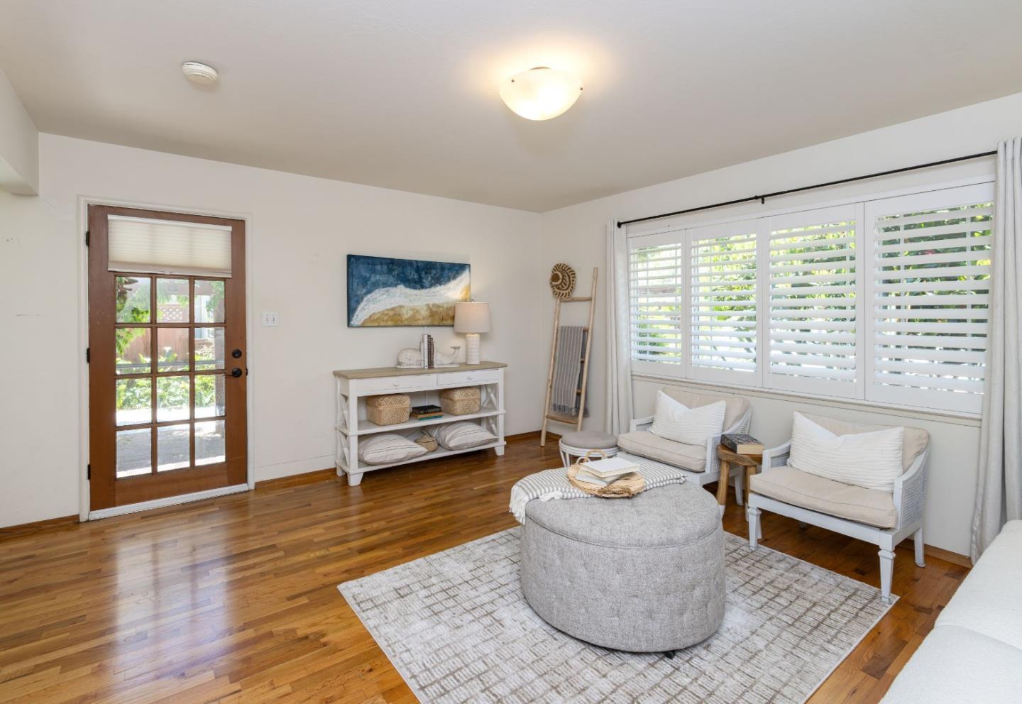 710-712 Riverview Drive Capitola, CA 95010 - Photo 4 of 37 a living room with furniture and a large window