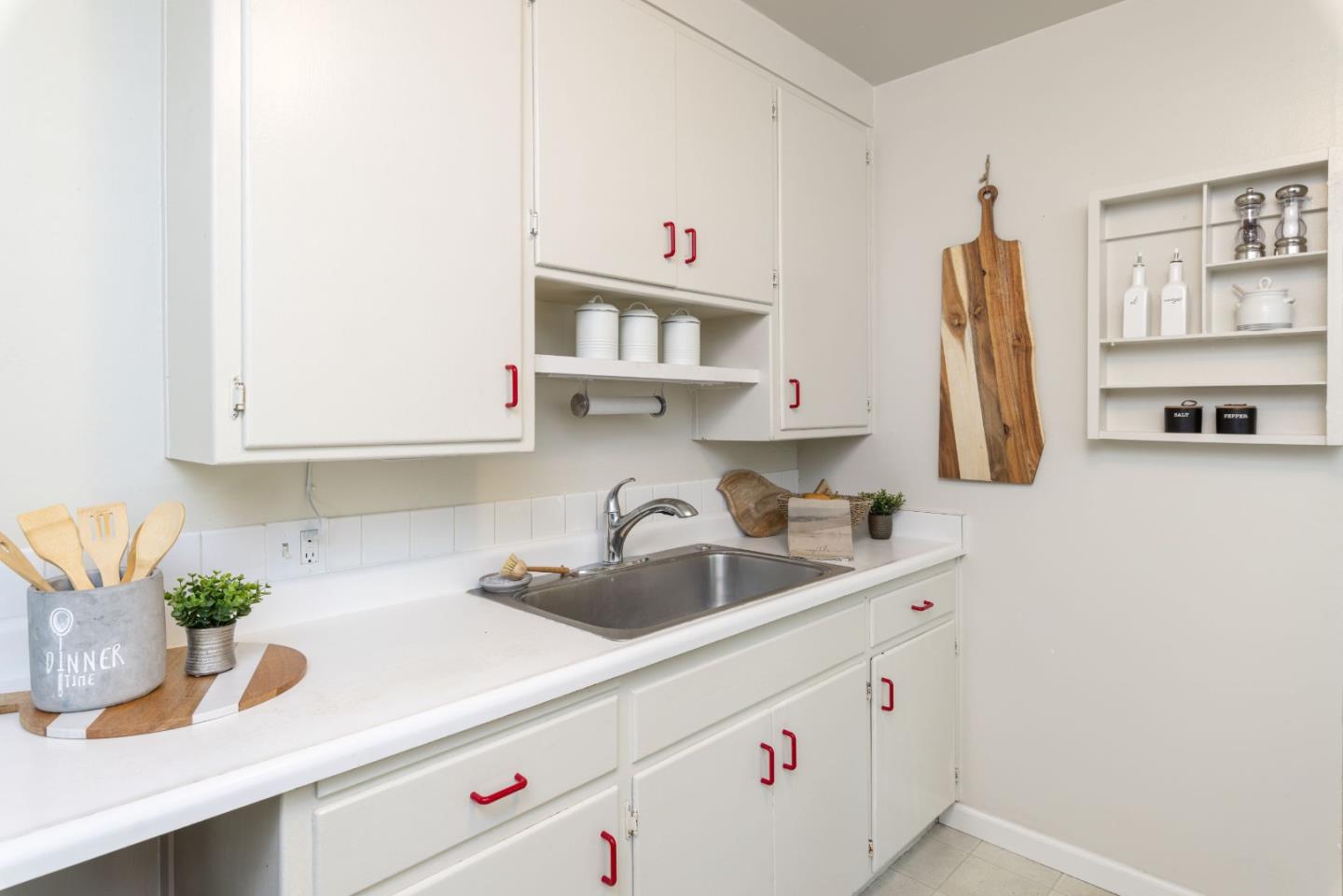 710-712 Riverview Drive Capitola, CA 95010 - Photo 9 of 37 a kitchen with stainless steel appliances a sink a refrigerator and cabinets