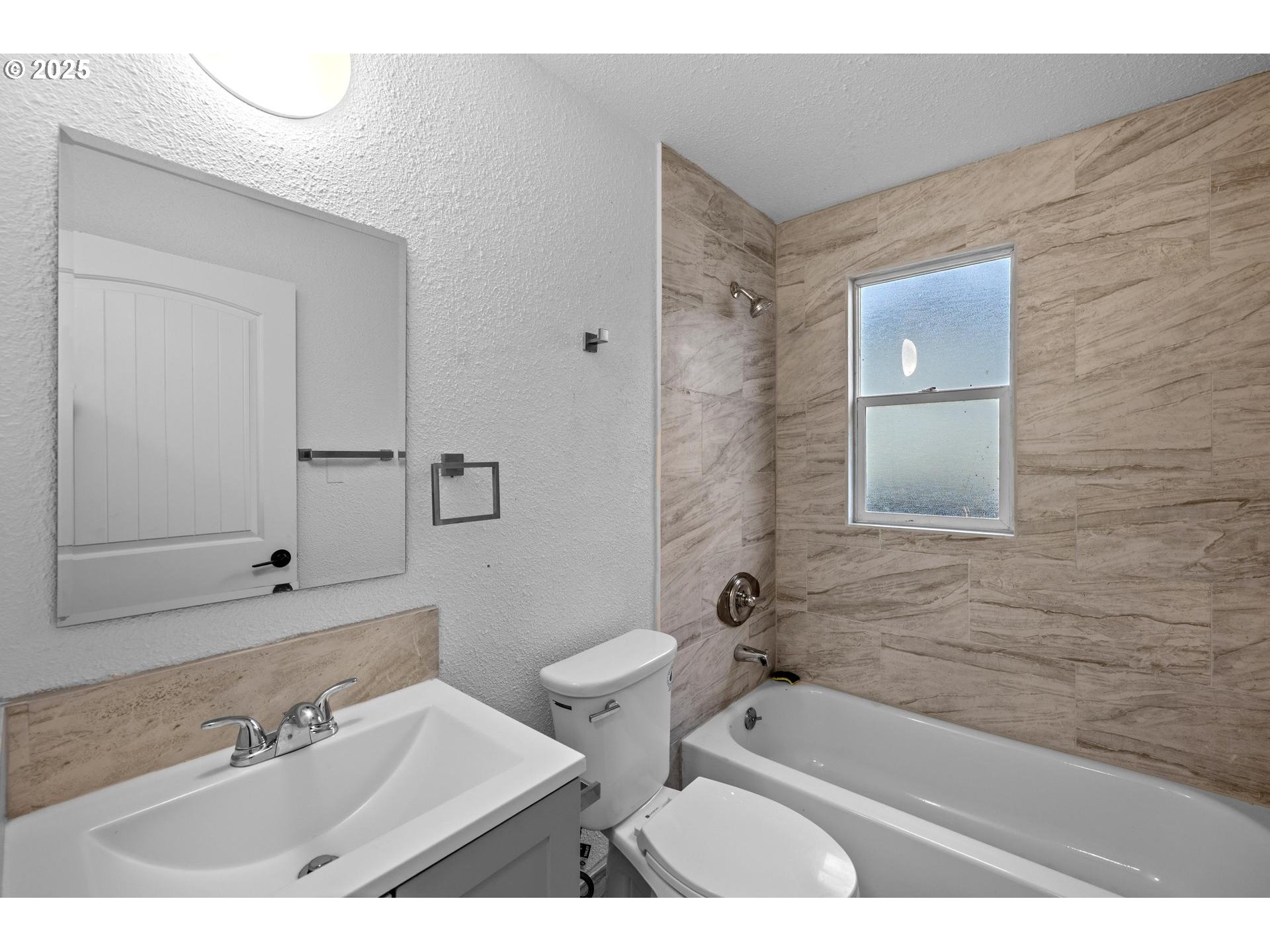 4804-4806 Northeast 111th Avenue Portland, OR 97220 - Photo 14 of 44 a bathroom with a sink and a mirror