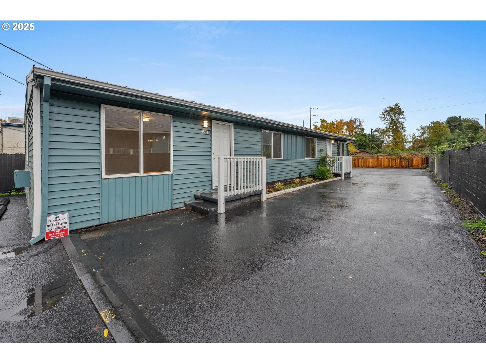 4804-4806 Northeast 111th Avenue Portland, OR 97220 - Photo 21 of 44 a view of a house with a yard